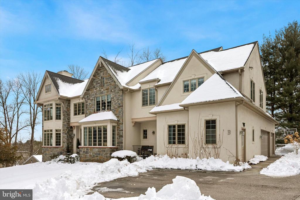 Privately set back on a lush lot, this beautifully upgraded stone colonial offers refined Main Line living.• Over $200,000 in thoughtful upgrades• Designer chef’s kitchen renovation with quartz slab surfaces• Grand two-story foyer filled with natural light• Great room with fireplace and custom built-ins• Luxury primary suite with private sitting lounge• Five spacious bedrooms with elegant finishes• Flagstone patio overlooking landscaped fenced yard• Walk-out lower level with high ceilings• Oversized three-car garage• Brand-new roof with transferable lifetime warrantyPrivately set back from the road on a lush, landscaped lot, this elegant stone-front colonial blends timeless architecture with over $200,000 in thoughtfully curated upgrades.A dramatic two-story foyer welcomes you into beautifully proportioned living spaces filled with natural light. The gracious living room is anchored by a marble gas fireplace and framed by soaring windows, creating a warm yet sophisticated setting for everyday living and entertaining. Across the foyer, the formal dining room showcases ribbon-inlay hardwood floors, refined millwork, and elevated lighting.At the heart of the home, the fully upgraded chef’s kitchen and great room create an exceptional gathering space. Custom cabinetry, premium appliances, quartz slab countertops and backsplash, and a striking mosaic marble accent complement the oversized center island with bar seating and secondary oven. The sunny breakfast room flows seamlessly into the inviting great room, where custom built-ins and a gas fireplace enhance both comfort and style.A sun-filled home office, dual powder rooms, and a secondary entry with laundry and mudroom provide everyday convenience and direct access to the oversized three-car garage.Upstairs, the expansive primary suite offers a tray ceiling, private sitting lounge or dressing room, and a spa-inspired bath featuring vaulted ceilings, a glass walk-in shower, soaking tub, private water closet, and generous walk-in closets. Four additional bedrooms offer flexibility for family, guests, or workspace, complemented by two well-appointed Jack-and-Jill bathrooms.The oversized walk-out lower level with high ceilings presents endless possibilities for a home theater, gym, recreation room, or wine cellar.Outdoors, a flagstone patio overlooks the professionally landscaped and fenced backyard—an ideal setting for entertaining, relaxing, or play.A newly installed roof with a transferable lifetime warranty provides lasting peace of mind. Ideally located just minutes from Ellis Preserve shopping and dining, premier clubs including Radnor Hunt, and major commuter routes, this exceptional home offers the perfect balance of privacy, convenience, and modern luxury.