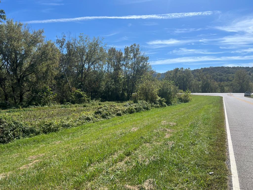 Discover a rare opportunity to own 6.4 acres of unrestricted land in Marble, NC, located directly opposite the Freedom Industries facility at the intersection of US Hwy 19/74/129, Marble Plant Road  and Airport Rd. This versatile property, offered below recent professional appraisal, is a blank canvas for your dream home, homestead, recreational retreat, or commercial venture in the heart of the Appalachians. Unbeatable location & accessibility. Strategically positioned for convenience, this parcel is just:  4 miles from Andrews-Murphy Regional Airport, 10-15 minutes from downtown Murphy's shopping, dining and attractions.  A short drive to Harrah's Cherokee Valley River Casino, Lake Hiwassee, and 90,000+ acres of Nantahala National Forest for outdoor adventures. Key Features:  Acreage & Terrain: 6.4 acres of flat land and multiple potential building sites.  No Zoning/Restrictions: Build, subdivide, farm, or recreate – no limitations.   Utilities & Access: Road frontage on maintained Marble Plant Road; power nearby (buyer to verify septic/well).  Perfect for buyers seeking freedom, flexibility, and value.