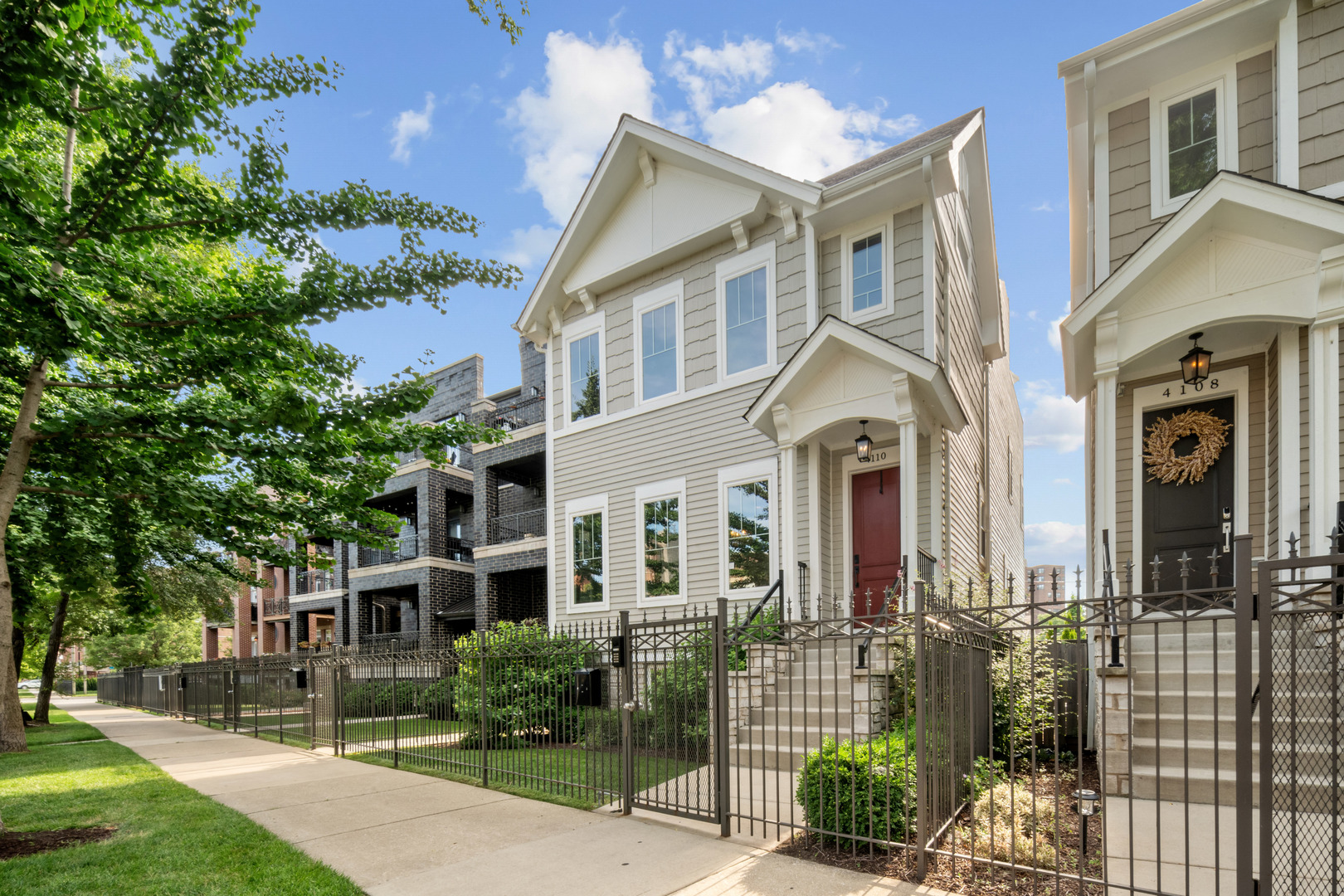 Experience luxury living in the heart of Bronzeville with this stunning 5-bedroom, 3.5-bathroom home, built new in 2018 and meticulously maintained. Move-in ready, this residence boasts countless upgrades including custom paint, elegant window treatments, trey ceilings, integrated surround sound, and a fully finished garage that is insulated, has an EV charger and can double as a studio, office, and/or home gym. The thoughtfully designed floor plan offers both warmth and functionality, perfect for entertaining or relaxing at home.    The main level features a formal dining room and an exceptional gourmet kitchen equipped with top-of-the-line Jenn Air appliances, quartz countertops, a pot filler, wine fridge, and an oversized island ideal for gatherings. Just off the kitchen is a cozy family room complete with a fireplace and custom built-ins, creating the perfect everyday living space. A spacious, fully built-out mudroom is conveniently located at the rear entry, adding both style and practicality.    Upstairs, the second floor offers three generous bedrooms, including a luxurious primary suite with expansive closets and a spa-inspired bathroom featuring marble finishes, heated floors, and a striking wet room with a combined shower and soaking tub. The lower level expands the living space with two flexible gathering areas- a den or family room area with a wet bar and a custom home theater with stadium seating and full projector screen, which could be easily converted into an additional bedroom. A fourth bedroom is also located on this level.    Outdoor living is elevated with a beautifully designed backyard patio and a custom outdoor fireplace, ideal for entertaining or unwinding under the stars. The fully finished rooftop deck provides even more space to relax or host in style. One of the most unique features of this home is its location within a private, gated alley-a rare amenity that creates a secure environment where neighbors socialize and children can safely play.    This exceptional home is filled with thoughtful details and premium features-you truly have to see it to believe it. Some furniture can be sold as well.