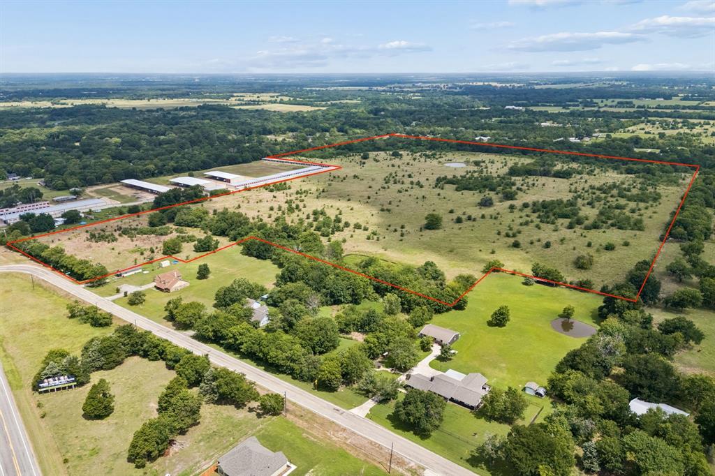 Rare opportunity to own 63 acres of versatile Texas land with exceptional visibility and access in one of Northeast Texas's fastest growing corridors. Strategically positioned off Interstate 30 with 450 feet of frontage on FM 499 and I-30, this property offers the kind of location investors and developers dream about with high traffic exposure. The tract features a beautiful mix of open pasture, scattered mature trees, and a stocked pond, making it as visually appealing as it is functional. Zero floodplain every acre is usable. Currently carrying an agricultural exemption, keeping your carrying costs low while you plan your next move. Whether you're looking to hold as a long-term investment, develop commercial or industrial uses capitalizing on the I-30 corridor traffic, or build your dream ranch-style retreat, this land checks every box. Utilities are available at the road, making future development straightforward. Neighboring storage facilities demonstrate the commercial viability of the area, and being outside city limits offers flexibility with fewer restrictions.