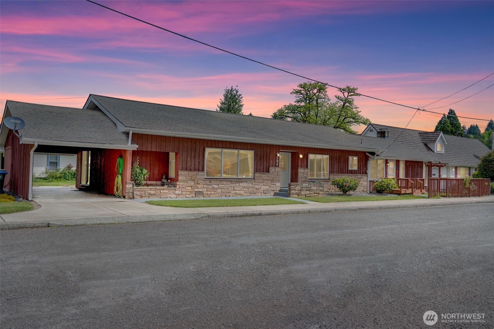 This spacious three-bedroom rambler is loaded with upgrades and ready to impress. Enjoy peace of mind with a new roof, new flooring, and modern LED lighting throughout. The updated kitchen shines with contemporary finishes, while the luxurious primary bathroom features a spa-like retreat complete with a 12-head shower and soaking tub.  Step outside to discover a hidden secret garden—a tranquil oasis with a patio, deck, and an arbor draped in roses, kiwi, hops, and grapes. The outdoor space is completed with a new brick-lined sidewalk and covered patio, perfect for relaxing or entertaining. The mini-shop and woodshed provide extra storage. Don’t miss this one-of-a-kind home that blends comfort, style, and charm both inside and out!