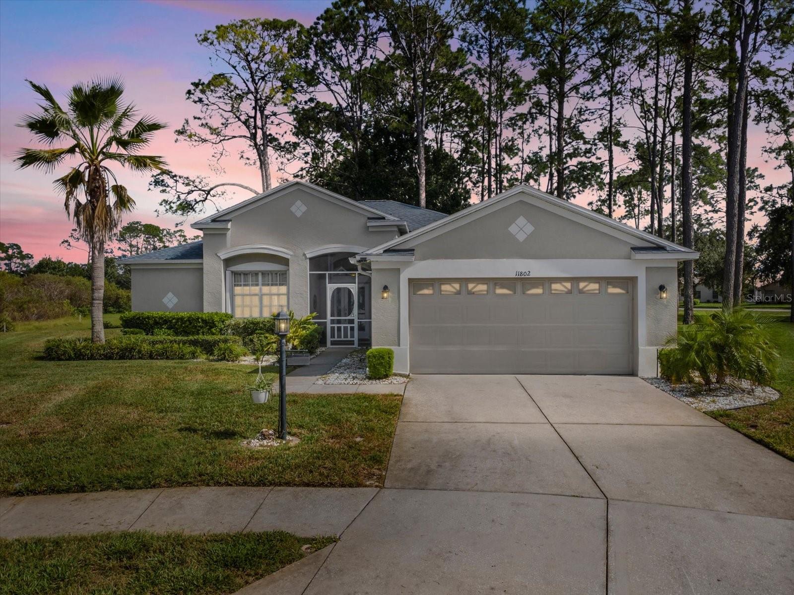 THIS IS IT!!! Your next home is in Heritage Pines, a 55+ Golf Course Community. You will have privacy outside your back door, no rear neighbors, and a large, enclosed Florida Room! What more could you ask for? How about enjoying this 3-bedroom, 2-bath, 2-car garage with a split floor plan. Upon entering, you will notice the oversized porcelain tile floors with 5" baseboards throughout the home. The eat-in kitchen has plenty of counter space, a large walk-in pantry, and a breakfast bar. The primary suite includes a walk-in closet & linen closet, dual sinks, walk-in shower, and a separate commode. Did I mention that when you walk out of your enclosed Florida Room, you have an extended 24x10 paver patio! Great for grilling, entertaining, or just hanging out with family and friends. The home is a Pinehurst Model, the roof was replaced 2025, the HVAC was replaced in 2021. The HOA includes Internet, Cable, Community activities, and a heated pool, year-round. If you don't feel like cooking, Heritage Pines has an excellent Restaurant and Bar to enjoy a snack or a full-course meal. Heritage Pines offers so much more that you'll have to come and see for yourself! Just so you know, it is well located near shopping, restaurants, parks, beaches, and easy access to major highways and airports. Why wait any longer? Call today for your private showing!