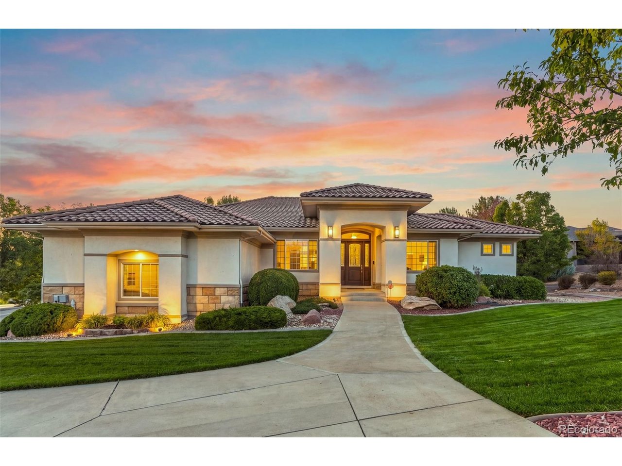 Set on more than an acre in one of Thornton's most established and sought-after neighborhoods, this custom Mediterranean-inspired ranch pairs distinctive architecture with exceptional indoor-outdoor living. Beautifully landscaped grounds surround the home, creating a private, mature setting with multiple spaces to relax and entertain, including a sunken hot tub thoughtfully positioned for maximum privacy. Inside, soaring ceilings, expansive windows, hardwood floors and architectural details give the home a sense of scale while remaining warm and inviting. The spacious kitchen and adjoining living areas are designed for gathering, while the walkout lower level provides exceptional additional space for entertaining, guests and everyday living. The primary suite is a retreat of its own, featuring a private fireplace, beautifully appointed bath with steam shower, and an expansive walk-in closet with abundant space for two. The grounds are every bit as impressive as the interior. Mature trees, lush landscaping and established plantings frame the outdoor living spaces, creating a peaceful sense of privacy that is increasingly difficult to find. An attached three-car garage provides generous parking and storage. A recently installed furnace, whole-home water filtration system and central vacuum add comfort and convenience, while a brand-new composite tile roof will be installed, complementing the home's architectural character while providing the durability and performance of modern materials. ***Offering more than an acre, a walkout design, exceptional outdoor living and a setting that feels remarkably private while remaining convenient to schools, shopping, medical facilities and major commuter routes, this distinctive property offers a rare combination of space, privacy and custom-home living in Thornton***