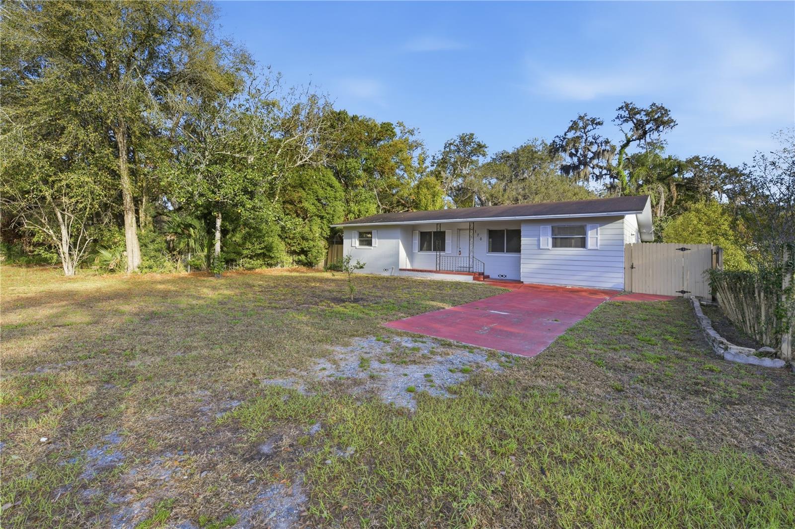 One or more photo(s) has been virtually staged. Located just moments from downtown Lake Mary, this single-story home offers an exceptional opportunity in a highly desirable area. Featuring three bedrooms and two bathrooms, the property provides a spacious layout with over 1,400 square feet of living space. Enjoy the convenience of being close to local restaurants, boutique shops, and the popular Saturday farmer’s market. Situated on a fenced lot with driveway parking, this home is ideal for buyers looking to renovate, invest, or create a personalized space in a prime location close to major roadways and everyday amenities.