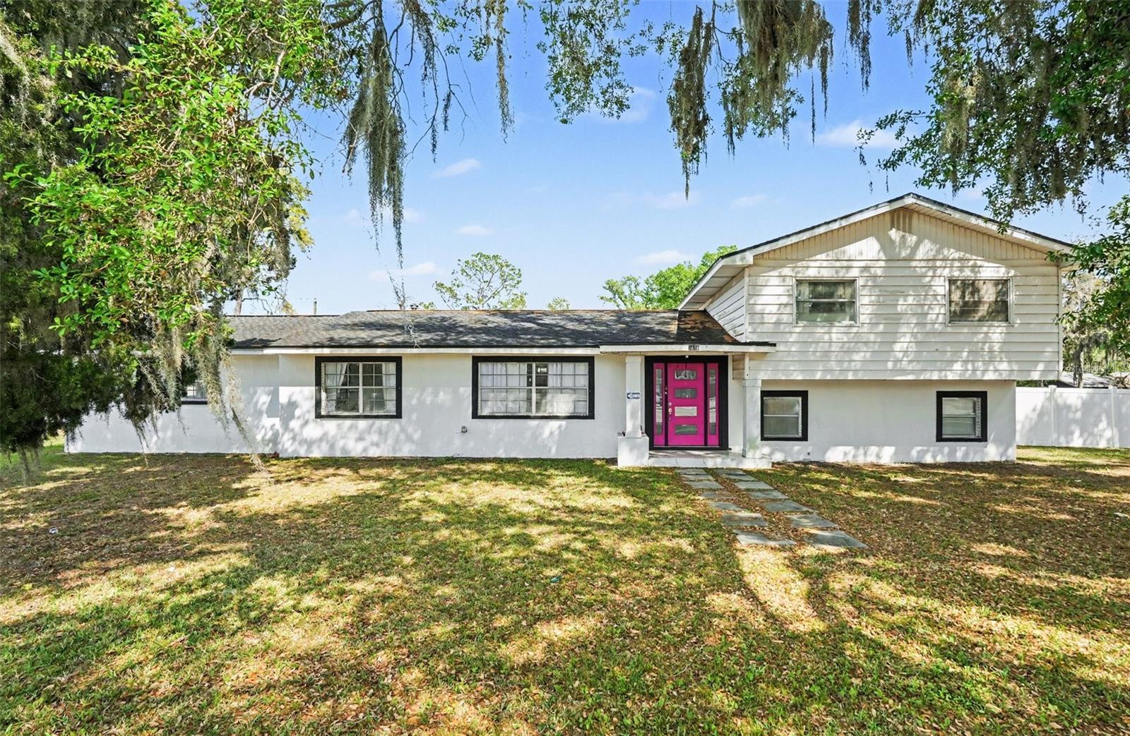 LOCATION & STUNNING UPDATES!! This 4 Bedroom/4 Bathroom home has it all! NO HOA, NO CDD! You must see to appreciate the many TOP QUALITY UPGRADES in this versatile tri-level home sitting on almost one acre (.90 acre). New Roof in 2018, Newer AC and Hot water Heater updated in 2021, New Sprinkler System with Automatic Timer, All New Plumbing and Electric in 2021! The Oversized Kitchen, designed as the center point and heart of it all, it’s is a Chef's dream with Granite Countertops, matching backsplash and Newer Soft-close Shaker Style Cabinets. New Stainless Steel Appliances added in 2021 include: Induction Flat Cooktop, Microwave/Convection Oven, Smart Refrigerator, with Stainless Steel Vent Hood. You will LOVE the wall to wall Glass Room in the rear of the home that could be used as a HUGE Familyroom, Mancave, or Flex space for multiple uses! This home boasts a WIDE OPEN floorplan with plenty of space for Family gatherings and a large open Formal dining room. Gorgeous White/Gray accent tile flooring seamless throughout the kitchen, dining room and formal living area. Smart Home features include: Bluetooth Lighting throughout including Bluetooth speakers in the Bathrooms, Electrical Patio Door with remotes, new Front Door with modern safety features and Smart Lights throughout operated using an App. Enjoy 2 Primary bedrooms both with fully updated en-suite bathrooms. The main Primary Bedroom on the lower level that has been transformed into an Owners Private Quarters with the en-suite boasting floor to wall GORGEOUS White & gray accent TILE, modern accents throughout including a Freestanding Soaking Tub, Dual sinks with Waterfall Faucets, Gray Shaker Style cabinets with a HUGE walk-in shower and Barn Door leading to the OVERSIZED Closet. The stairs have waterproof laminate flooring leading to the 3 additional bedrooms including the 2nd Primary suite with updated en-suite bathroom and a nice size walk-in closet. The Garage has been converted to an office with over 400 square feet of space, you could create part of this area into a workout space/Gym or even create a 5th bedroom! The possibilities are endless. Outside, the nearly one acre of land offers a feeling of privacy, peace and tranquility as you drive down the long extended concrete driveway through the Automatic Electrical Gate, the property has a private vinyl fence with a HUGE Concrete area for additional parking as well as parking for 2 RV's. The RV area has TWO 30 AMP Hook-ups (can be used for EV car charging) configured for two RV’s and a septic tank! With entertaining family and friends in mind, you will love the Open Concept HUGE detached lanai with outdoor Fireplace, 85 Inch Smart TV, an outdoor Kitchen and an exterior 4th Bathroom for added convenience, and a Firepit area for nightly entertaining! The location of this home is perfect for a small business owner, on a super-sized CORNER lot on Kings Ave., across from Kingswood Elementary School, the property could potentially be converted to commercial for endless opportunities. Situated in the heart of Brandon, close to restaurants, shopping areas and entertainment with easy access to HWY 301, HWY 60, I-75 and the Crosstown Expressway. To the west, it's about a one hour drive to the best Gulf Coast beaches and the Orlando theme parks to the east. Hurry this one won’t last – request a private showing today!