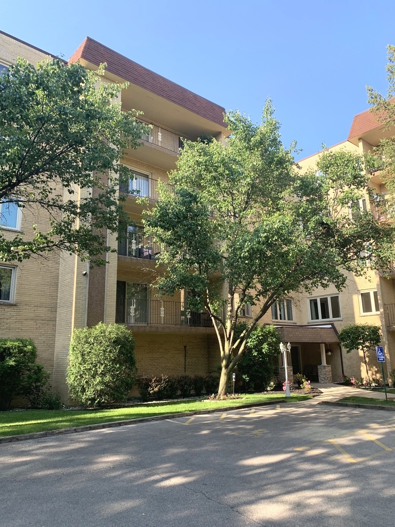 Completely renovated huge 2 bedroom unit on second floor in quiet elevator building.  Modern 2 bathrooms, with bathtub and the standing shower with body spray jets. Heated floor. Spacious living room, separate dining room. Beautiful, open kitchen with unique cabinets and modern quartz countertop. Stainless steel appliances. Good size bedrooms with double closets in each one. Laundry room in the unit. Newer windows, furnace and a/c. Large balcony with beautiful view. Heated indoor garage, space #2. Storage#4 and additional laundry room are on the same floor. This is a beautiful unit. The buyers will love it. Owner occupied only.
