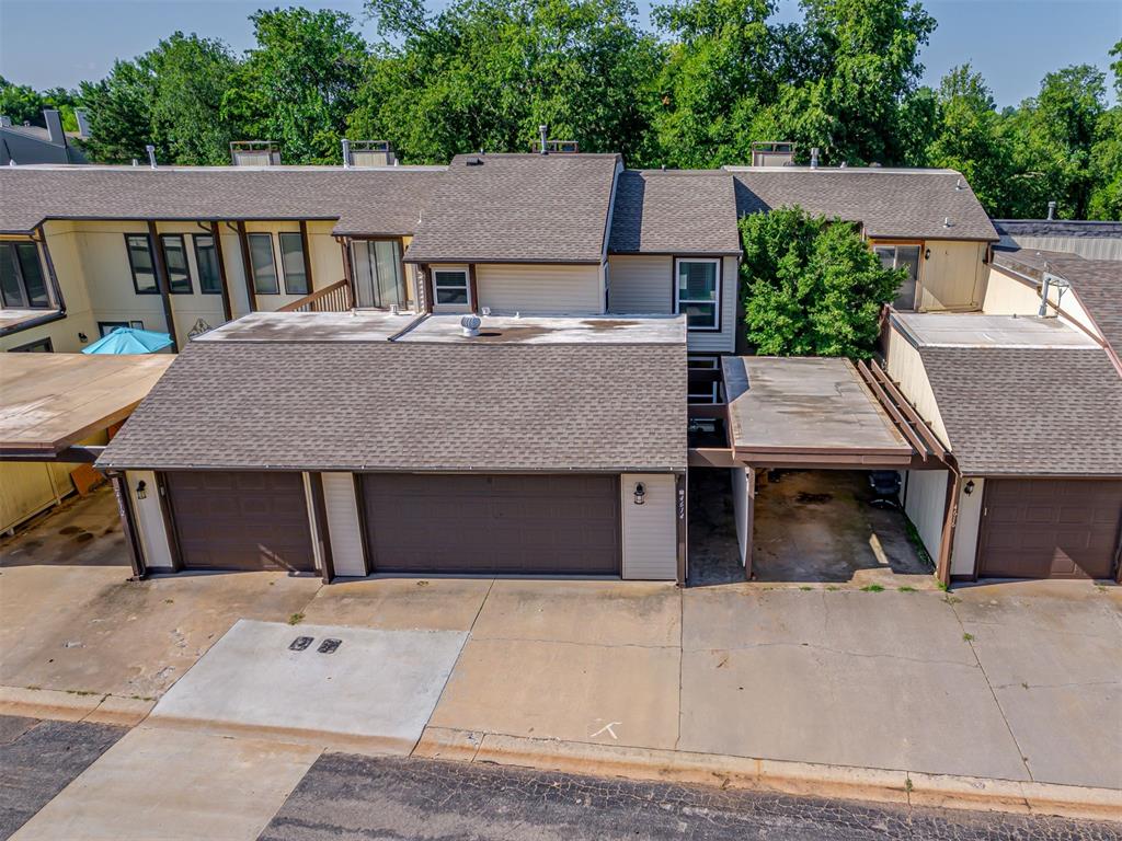Located in The Arbors addition of the Summerfield community, this well-maintained townhouse sits in the heart of Oklahoma City near Bluff Creek and Lake Hefner. As you walk through the home, you'll notice how well the wall paint, furniture, and artwork colors are thoughtfully coordinated throughout. Downstairs includes a spacious living room, dining area, breakfast space, and a half bath. The kitchen offers ample countertop and cabinet space with a small island. There is a great size laundry room located downstairs. A beautiful custom wood staircase railing adds character to the interior and leads to all three bedrooms upstairs, along with two full bathrooms. The primary suite features a large bathroom with a walk-in shower and has direct access to an open deck overlooking Bluff Creek. The home includes a two-car attached garage. The HOA maintains the lawn, which has been planted with fescue grass that thrives in shaded areas.