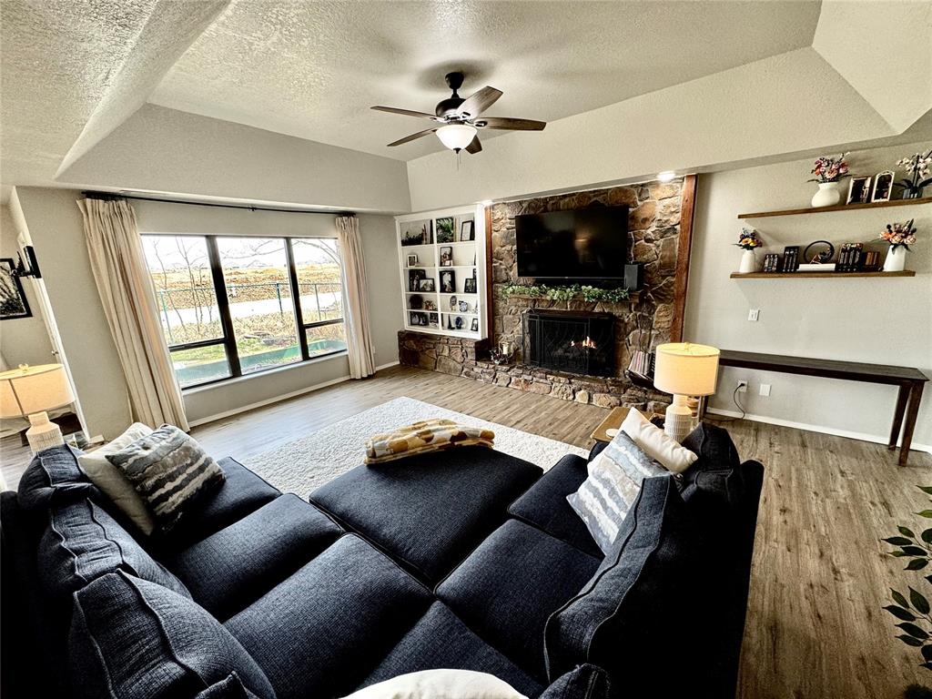 Welcome to this beautifully maintained home offering the perfect blend of warmth, space, and character. From the moment you walk in, you’ll appreciate the inviting layout featuring soaring ceilings, abundant natural light, and a stunning stone fireplace that anchors the spacious living room, creating the perfect place to relax or gather with family and friends. The kitchen is both functional and stylish, featuring generous counter space, ample cabinetry, and an open connection to the dining area with large windows that bring in plenty of light and backyard views. Whether you’re cooking, entertaining, or enjoying a quiet meal, this space was designed to feel welcoming and comfortable. The primary suite offers a peaceful retreat with a spacious bedroom, sunroom and a large bathroom featuring dual vanities, extensive counter space, and plenty of storage. The additional bedroom is well-sized and versatile, perfect for guests, family, or a home office. One of the home’s most unique features is the upstairs loft area, a flex space that could serve as a media room, playroom, or additional storage space. Thoughtful updates throughout the home include beautiful flooring, updated fixtures, and a clean, well-cared-for interior that makes this home truly move-in ready. The laundry room provides extra storage and convenience, while the layout offers both privacy and functionality. The oversized garage is perfect for parking two cars and still having a workspace and storage. Located in the heart of Moore, this home is minutes away from many great restaurants and shopping. Homes with this much character, space, and versatility rarely become available. Schedule your showing today and see everything this wonderful home has to offer!