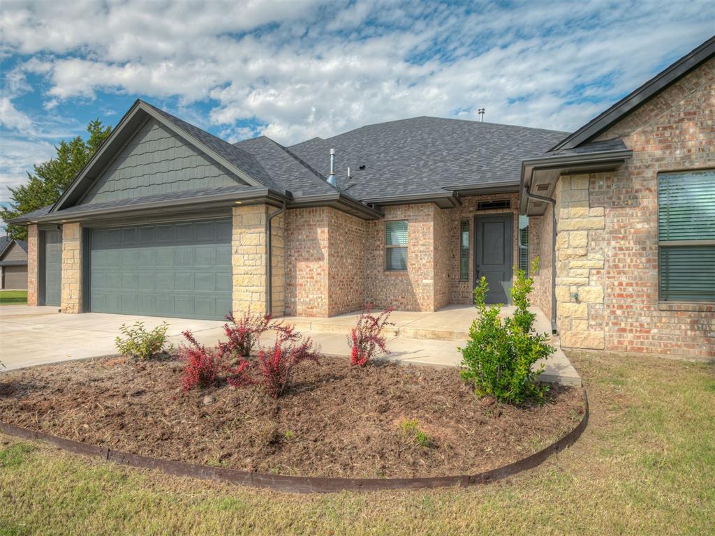 **MOVE-IN READY + $10,000 IN SELLER CONCESSIONS + 5-CAR GARAGE WITH DRIVE-THROUGH ACCESS!** This stunning 4-bedroom, 3-bath home offers approximately 2,507 SF of beautifully designed living space, incredible versatility, and features you won't find in just any home! From the gorgeous brick exterior and welcoming curb appeal to the spacious open-concept interior, this home is ready to impress! Step inside to discover soaring 10-foot ceilings, beautiful wood-look tile flooring, a cozy fireplace, and an inviting living area perfect for entertaining or relaxing. The kitchen is a showstopper with granite countertops, stainless steel appliances, stylish backsplash, breakfast bar, and walk-in pantry! Retreat to the spacious owner's suite featuring a charming bay window sitting area, soaking tub, separate tile shower, and oversized walk-in closet. A private secondary suite with its own bathroom offers wonderful flexibility for guests or multigenerational living. **GARAGE LOVERS, THIS ONE IS FOR YOU!** Enjoy an incredible 5-CAR GARAGE setup, including a DRIVE-THROUGH 4th and 5th garage area with front and rear overhead doors! Perfect for extra vehicles, recreational toys, hobbies, or workshop space! Outside, enjoy a covered patio, beautiful lawn, and mature trees that create an inviting setting for outdoor living. **AND HERE'S THE BONUS!** Seller is offering $10,000 IN CONCESSIONS to help with allowable buyer expenses, PLUS a 10-YEAR LIMITED STRUCTURAL WARRANTY THROUGH RWC for added peace of mind! No waiting for construction to finish—this beauty is MOVE-IN READY! **SPACE, STYLE, STORAGE, INCENTIVES, AND PEACE OF MIND—IT'S ALL HERE!** Don't just save this listing—schedule your private showing and come see everything this home has to offer!  HOA is $400 per year.