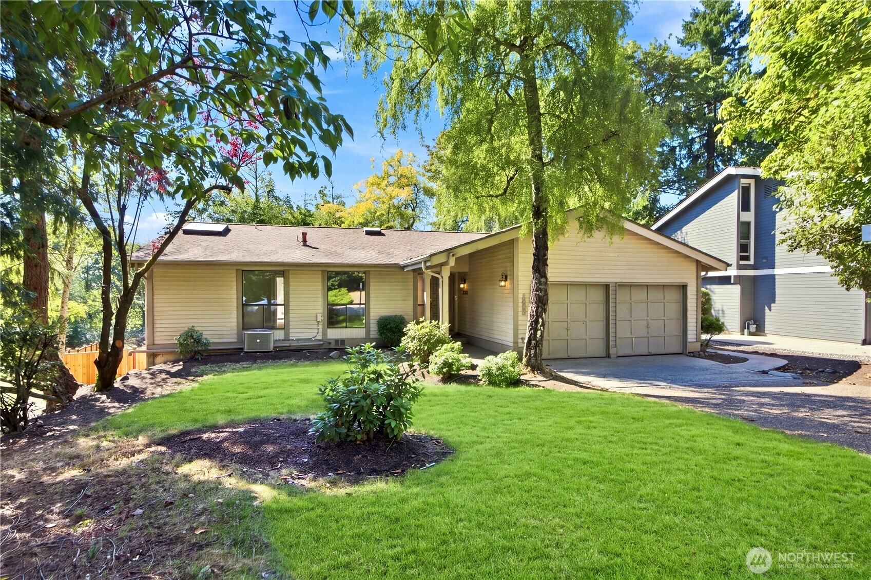 Available immediately! Well-maintained and thoughtfully designed 5-bedroom + 6th bedroom/den home on a quiet neighborhood street in the highly sought-after Bellevue School District. The functional floor plan features formal living and dining rooms, a spacious kitchen with granite countertops, a bright sunroom, vaulted ceilings, skylights, large decks, A/C, a tankless water heater, and newer flooring throughout. The lower level is fully set up for rental income, offering 3 bedrooms, a kitchen, and a utility room. Step outside to a newly fenced, level, and private backyard backing to peaceful greenery, with mature fruit trees and dedicated gardening space. Enjoy the community’s Highland Trail, offering a peaceful and private outdoor experience just steps from home. Ideally located within the award-winning Bellevue School District—Somerset Elementary, Tyee Middle, and Newport High School. Property is being sold as-is, with no seller repairs, upgrades, or improvements to be provided.