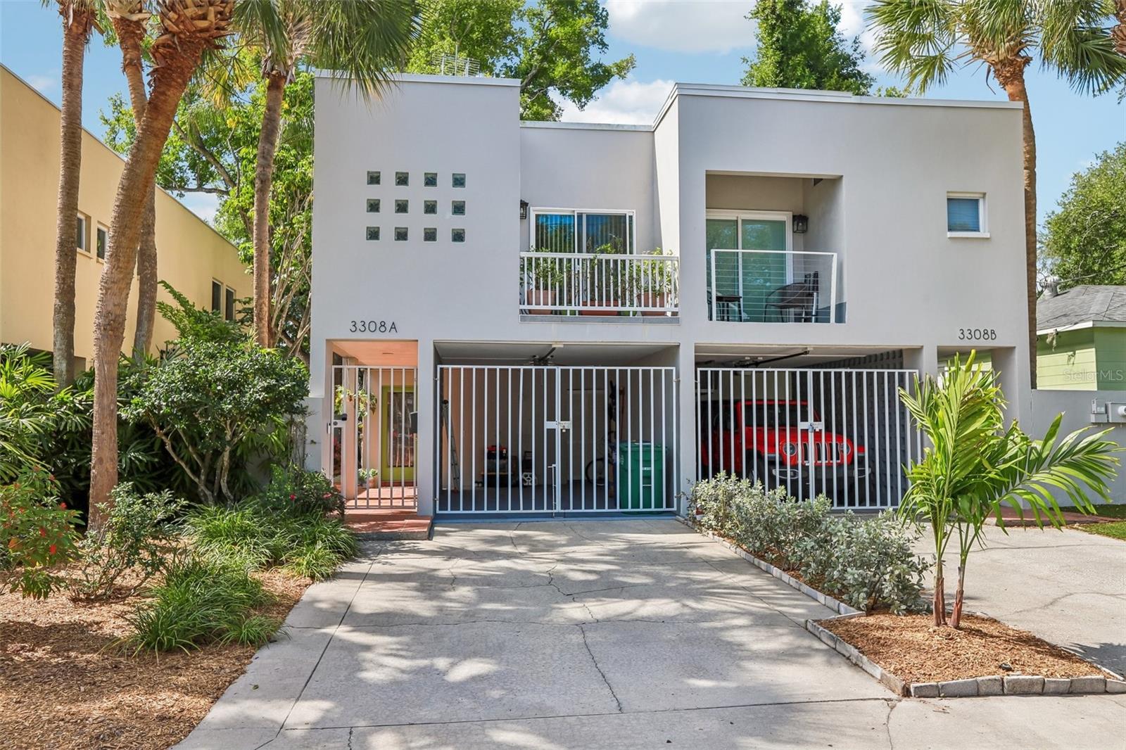 Nestled in the heart of South Tampa’s prestigious Palma Ceia neighborhood with NO HOA fees.***Seller is currently offering $10,000 towards closing costs, a mortgage rate buy-down with an acceptable offer***This is a masterclass in modern coastal architecture and airy, light-filled design. This stunning 2-bedroom, 2.5-bathroom residence makes a bold first impression with its dramatic double-height ceilings and a signature glass-block feature wall that bathes the interior in soft, natural light. The home has been extensively refreshed with a long list of premium updates, including fresh interior paint, new interior doors, new baseboards, and a mix of stylish new vinyl plank flooring and plush carpeting. The open-concept living area flows into a functional kitchen, while the bedrooms have been upgraded with a new primary slider and a fully renovated primary ensuite featuring a brand-new walk-in shower, modern vanities, sinks, faucets, and toilets.Beyond the aesthetic upgrades, the home offers peace of mind with a new water heater and a new garage gate opener for security. The outdoor living is equally impressive, centered around a brand-new deck and a secluded sanctuary enhanced by upgraded landscaping and vibrant tropical greenery. The deck in the back corner, behind the tree, is already wired with 220 power for a Jacuzzi for the ultimate spot to relax!Located within the highly coveted Plant High School district and just minutes from the scenic Bayshore Boulevard and Hyde Park Village, this move-in-ready home offers an unbeatable lifestyle in one of Tampa’s most vibrant communities.