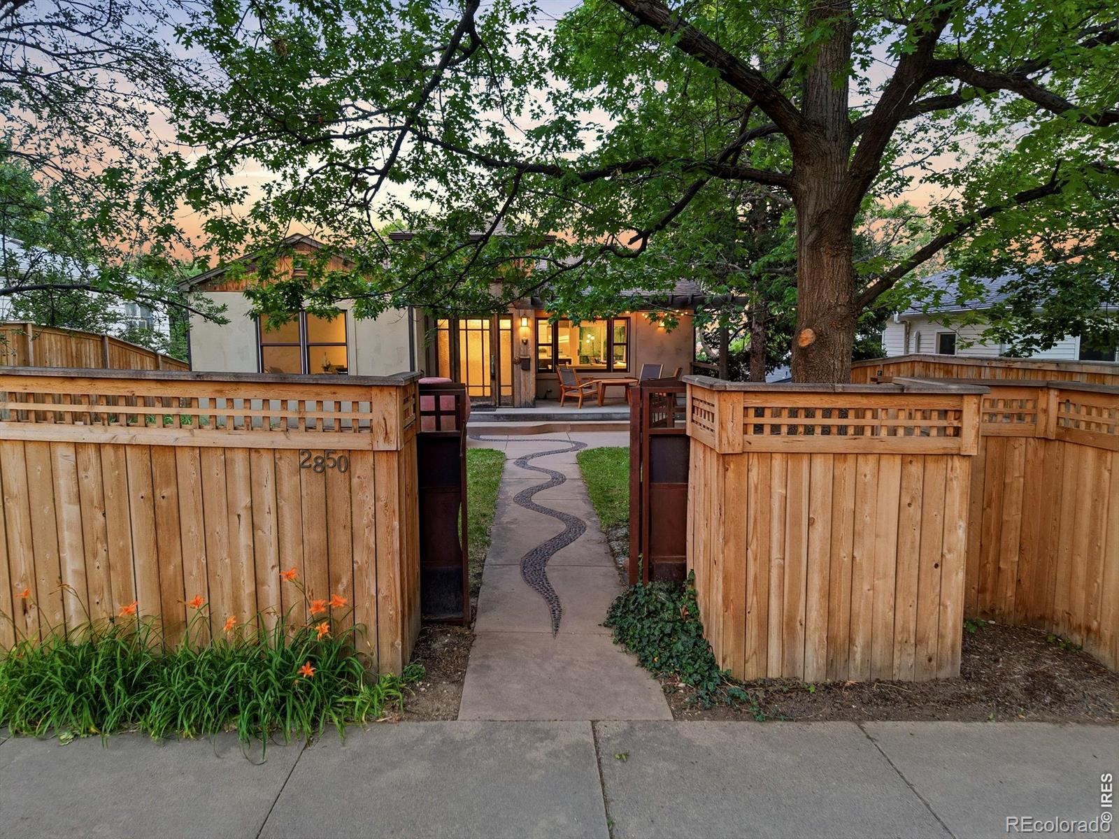 NEWLANDS HOME! This updated gem sits in the heart of the Newlands neighborhood, just moments from the trails of Mount Sanitas and the greenery of North Boulder Park. Custom design shines through an artful steel gate and vaulted entry that leads into a bright interior featuring refinished hardwoods. The open kitchen is a chef's dream, anchored by a quartzite island and premium Viking and Subzero appliances. Outside, a private Ipe hardwood deck offers city views and a salt water hot tub for ultimate relaxation. Complete with a detached garage and off-alley parking, this home is perfectly positioned near Ideal Market and local favorites like Baleza Coffee and Sweet Cow. This is the Boulder lifestyle. YES!