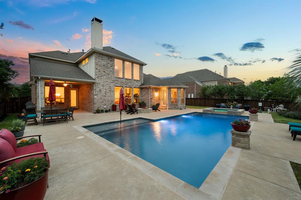 Nestled in one of Keller’s most desirable neighborhoods, 1505 Mossycup court presents a rare opportunity to own a beautifully maintained home that embodies timeless elegance, thoughtful design, & luxurious amenities. This residence reflects pride of ownership throughout. From the moment you arrive, you’ll be captivated by the home’s stately curb appeal. Mature landscaping, manicured lawns, & welcoming entryway set the tone for what lies beyond. Step inside & experience fresh interior paint in modern, neutral tones that create a light and airy ambiance throughout the home. The well-thought-out floor plan is both spacious & functional, offering an ideal layout for families of all sizes. The main living area is the heart of the home, featuring large windows that allow natural light to pour in, creating a warm & welcoming atmosphere. High ceilings & architectural details add character and dimension, while the open-concept design provides seamless flow from room to room. Hand-scraped hardwood floors grace all bedrooms, offering a touch of rustic charm and durability. These rich, dark-toned floors contrast beautifully with the home’s lighter walls & add a sense of continuity & sophistication throughout the private living areas. At the heart of the home lies a gourmet kitchen that will impress even the most discerning home chef. Outfitted with high-end stainless steel appliances, generous granite countertops, &  custom cabinetry, this kitchen is as beautiful as it is functional. A large center island provides extra prep space and serves as a hub for casual dining or socializing. Additional features such as a gas cooktop, double ovens, and walk-in pantry ensure you have everything you need to prepare meals with ease and elegance. Open sight lines to the family room and breakfast nook make this kitchen perfect for both everyday living and hosting lively get-togethers. This home is move in ready.