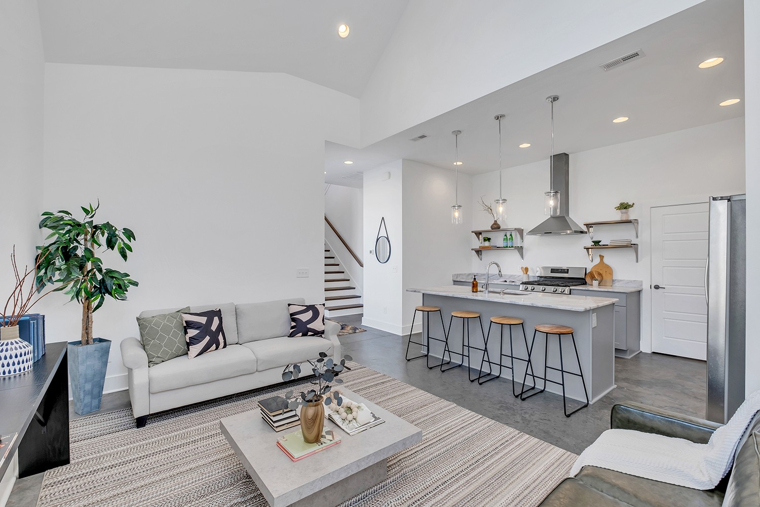 Modern living in the hot 12 South area - amazing views of Belmont, downtown, & more! Hardwood + Concrete Floors, High Ceilings, Tons of Natural Light + Storage, Entertainer's Layout. Open Living + Dining w/soaring two-story ceiling, Eat-In Kitchen w/quartz countertops/ss appliances/step-in pantry, Laundry on both floors. Primary Suite on Main w/spa bath + step-in closet, 2 Bed Suites Up. Covered Front Porch/Patio + Double Decks! Small private deck for low-key relaxing + large rooftop deck w/million-dollar views! ~ Walk to Belmont, Vandy, 12 South, Edgehill, parks, attractions & more ~ 7 min. to downtown!