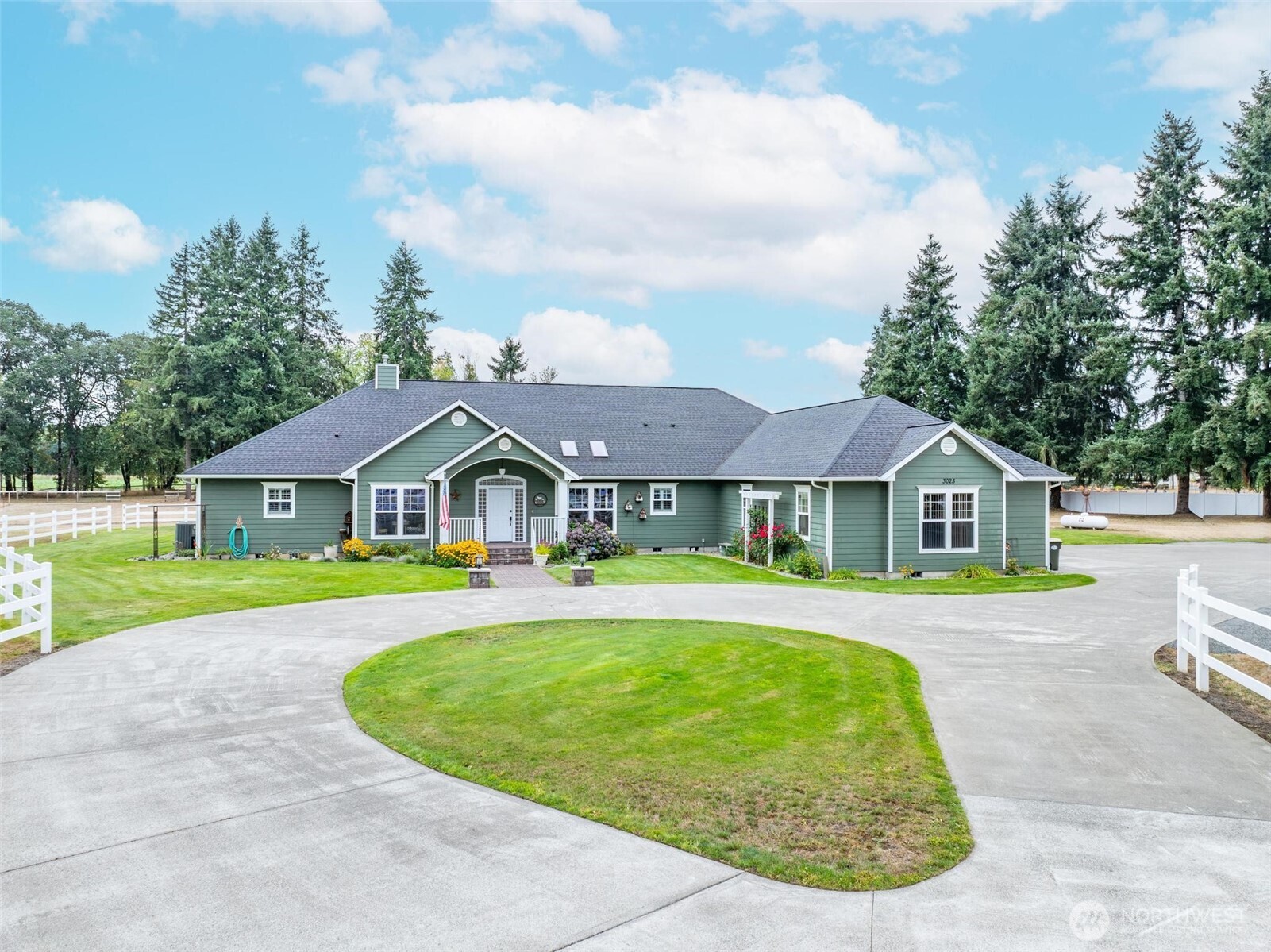 This custom 4,000 sq ft rambler offers spacious, single level living and a private setting. Situated on a well maintained 2 acres. Located near the end of a private paved road. The kitchen features newly upgraded countertops and stainless steel appliances connecting to a cozy family room. The formal living room includes charming fireplace and a dedicated dining room provides elegant spaces for entertaining and hosting holidays. Primary bedroom and bath have direct access to the hot tub. The two additional bedrooms each feature their own private bathroom and walk-in closets. 2 car attached garage with office space plus 40x40 shop with 2-10 ft doors and 1-12 ft door plus loft for storage.