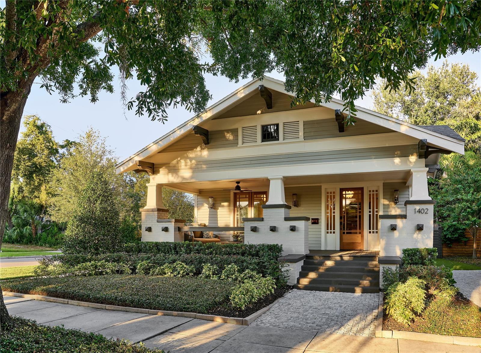 Step into timeless sophistication at this exquisitely restored Hyde Park residence, masterfully reimagined in 2025 where historic elegance meets refined modern luxury. The home underwent a comprehensive, year-long interior and exterior renovation led by award-winning Aspen-based designer Anne Grice in collaboration with Noble Haus Studios, resulting in a residence of exceptional quality, detail, and architectural integrity. Offering nearly 3,100 square feet of thoughtfully curated living space, this 4-bed, 3-bath home sits on a large, sun-filled corner lot. Designed with an exceptional layout that prioritizes privacy and separation of space, the home lives substantially larger than its square footage, offering multiple distinct living areas that feel both expansive and intimate. The first level showcases superior craftsmanship with rich hardwood floors, detailed crown molding, plantation shutters, and designer finishes throughout. The formal living room is anchored by coffered ceilings, period & custom lighting, and a capped fireplace, creating an elegant yet inviting setting. A private office just beyond features bespoke lighting, recessed illumination, and custom built-in bookcases. The formal dining room, enhanced by wainscoting and matching coffered ceilings, is ideal for both intimate dinners and refined entertaining. The expansive kitchen serves as the heart of the home and is thoughtfully designed for both daily living and elevated entertaining, featuring custom cabinetry, refined stone surfaces, and a layout that balances beauty with function. A substantial island anchors the space, while a charming built-in breakfast nook adds warmth and everyday practicality. The adjoining family room, framed by coffered ceilings and French doors, opens seamlessly to the rear patio, offering effortless indoor-outdoor living. The main-level primary suite is a true private retreat, featuring a spa-inspired bath with dual marble vanities, an enclosed walk-in shower with dual shower heads, a soaking garden tub, and a generous walk-in closet with custom built-ins. A second main-floor bedroom with custom lighting and built-in closet storage, a marble-clad full bath, and a conveniently located laundry area complete the first level. Upstairs, two additional bedrooms, a full bath with dual marble vanities and a shower-tub combination, and a cozy sitting room provide flexible and comfortable living spaces. The outdoor setting is equally refined, designed for relaxation and entertaining with a covered patio, sun lounger deck, paver terrace, and a sparkling in-ground pool. A fully fenced, turfed yard is complemented by a charming gazebo and an outdoor shower, creating a private and serene oasis. Meticulously maintained and thoughtfully updated, the home features newer systems and extensive high-end improvements, including a roof (2019), AC (2020), fully renovated bathrooms, custom cabinetry, refinished floors, curated wall coverings and drapery, fresh interior and exterior paint, new front doors, enhanced insulation, and professionally updated landscaping. Enjoy an unrivaled prime location near the sophisticated Hyde Park Village and the vibrant SoHo District, placing local shops, world-class restaurants, and exclusive entertainment just moments away. The home is zoned for top-rated public schools: Mitchell Elementary, Wilson Middle School, and Plant High School.