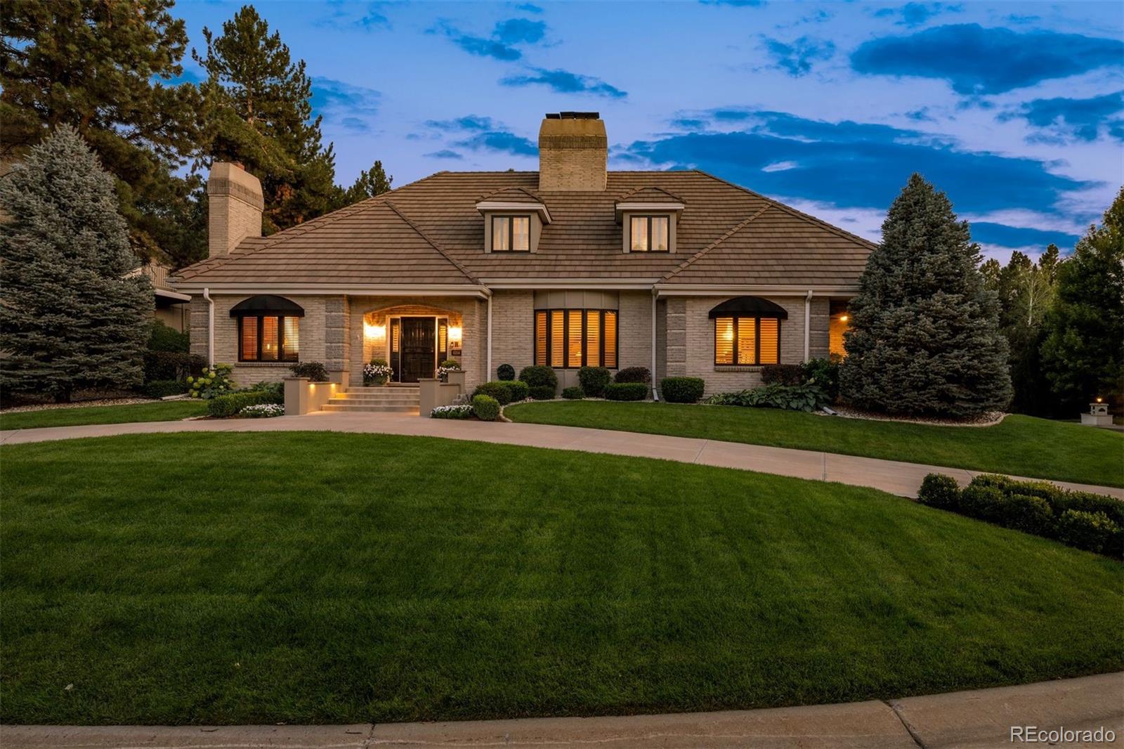 Nestled in the prestigious Charlou neighborhood of Cherry Hills Village, 6356 E Tufts Avenue is a distinguished 6-bedroom, 7-bathroom estate that effortlessly combines timeless elegance with modern comfort. Thoughtfully designed and crafted with meticulous attention to detail, this exceptional home features a main-floor primary suite complete with dual walk-in closets, electric plantation shutters, and a spa-inspired bath with radiant in-floor heating. Inside, rich oak flooring, four gas fireplaces, and elegant finishes infuse the home with sophistication. At its heart lies a chef’s kitchen, complete with Crystal custom cabinetry, granite countertops, a wine cooler, a wet bar with beverage fridge, and a versatile butler’s pantry—perfect for everyday living and effortless entertaining. Two spacious living rooms and a formal dining area provide  spaces to host guests, while a private front-facing office offers a quiet retreat for work or study. Upstairs, you’ll find four bedrooms, as well as a flexible TV or office space. The finished basement offers incredible versatility, whether you're looking to create the ultimate home gym, a media room, or host unforgettable gatherings, this spacious area is perfectly suited for both entertaining and staying active. Elegant architectural touches and Pella French doors create a seamless indoor-outdoor connection, opening to a private backyard sanctuary. Enjoy a covered flagstone patio with a retractable electric shade, lush mature landscaping, a fenced in yard, and a rare grandfathered sport court.  The home's exterior is elevated by thoughtful features such as heated front steps, a custom pergola, and cement tile roof. An oversized three-car garage with epoxy floors, built-in storage, and dual exterior access adds to the home’s convenience. This is a rare opportunity to own a legacy estate in one of Colorado’s most coveted communities.
