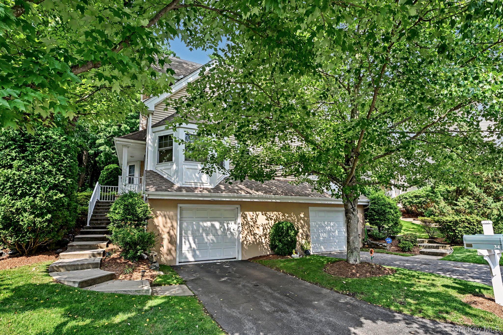Welcome to Winding Ridge, one of Westchester County's best-kept secrets for low-maintenance living. Tucked away in a peaceful, tree-lined setting, this sought-after community offers the perfect balance of privacy and accessibility - located just minutes from the restaurants, shopping, entertainment, and Metro-North in downtown White Plains.Sparkling from top to bottom, this beautifully maintained townhome is truly move-in ready. Thoughtfully designed with generously sized rooms, oversized closets, vaulted ceilings and an abundance of natural light, the flexible floor plan offers incredible versatility. Two spacious bedrooms are complemented by three full bathrooms and a powder room, while the loft provides the ideal space for a home office, artists studio, or hobby room. The finished lower level, complete with a full bathroom, is perfect for a recreation room, guest accommodations, fitness space, or whatever best suits your lifestyle. Recent improvements include all new windows (2022), a new refrigerator (2023), and fresh interior paint (2026), providing comfort and peace of mind for years to come.Step outside to a spacious patio, lawn and peaceful wooded backdrop, creating a quiet setting for morning coffee or evening relaxation. Community amenities include a swimming pool, fitness center, tennis courts, a playground, and beautifully maintained grounds. Pet-friendly and exceptionally convenient, Winding Ridge offers a lifestyle that's hard to match.