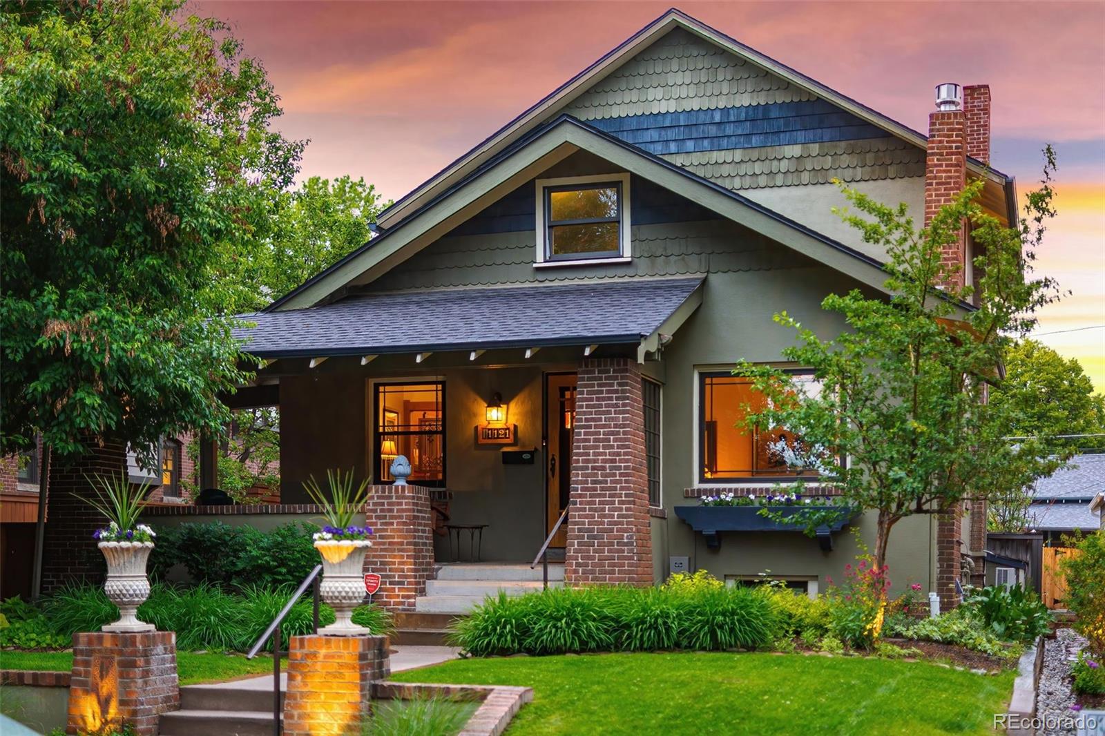 Set on a quiet, tree-lined street just two blocks from Washington Park, this home offers a great balance of charm, livability, and location. The home was intentionally expanded to create a layout that works well for both everyday living and entertaining. The main level has a natural flow, with bright living and dining spaces that lead into a spacious kitchen and family room overlooking the backyard. There’s also a dedicated office with built-ins, ideal for working from home.Upstairs, you’ll find three bedrooms and two baths, including a primary suite with a Juliet balcony and mountain views. The finished basement adds flexibility with a second living area, two additional bedrooms, and a full bath, perfect for guests, a gym, or additional workspace. The backyard was redesigned in 2023 and really stands out, with a beautifully landscaped yard and multiple areas to relax or entertain. It includes a heated seating area, patio, hot tub, water feature, fireplace, and a pergola with an established vine for shade and character. The dining room opens directly to the side patio, making the indoor-outdoor flow feel easy and connected.Additional features include an oversized two-car garage with plenty of storage for Colorado gear, two laundry areas, updated windows with built-in blinds, heated sidewalks out back, and a hidden loft/playroom tucked into an upstairs closet. Right in the heart of East Wash Park, you’re just a short walk to South Gaylord’s restaurants and shops, with quick access to Cherry Creek, downtown, and I-25—while still feeling tucked into a true neighborhood setting.