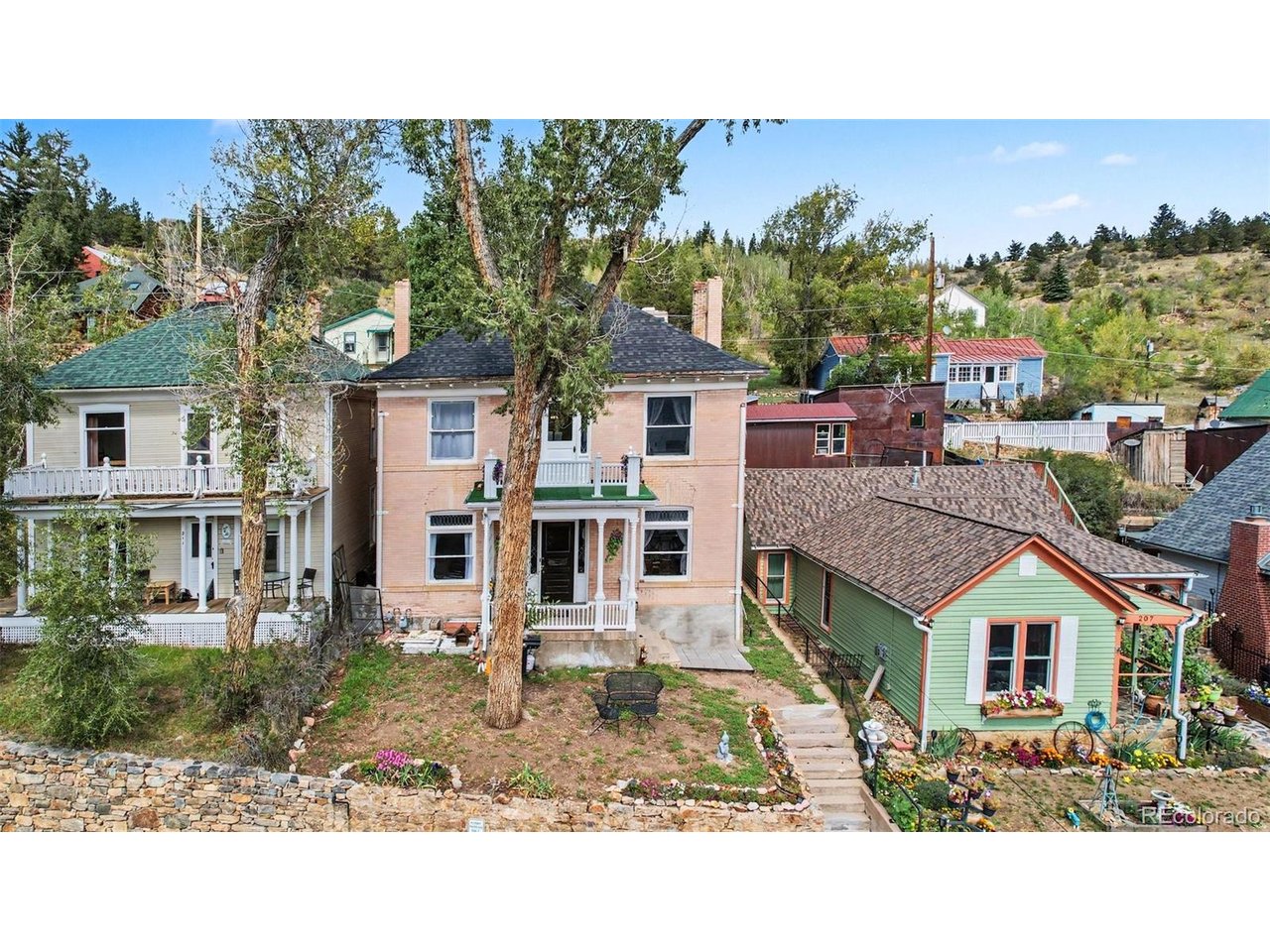 Historic Central City charm meets modern luxury! This one-of-a-kind home has been extensively and thoughtfully updated over the past three years, offering modern finishes, smart appliances, custom details, and stunning mountain and Central City views-all in the heart of Old Town.Step inside to a custom game/media area with a built-in dual-PS5 setup, spacious living area, and an extensively updated kitchen featuring smart appliances, generous dining space, and a separate coffee bar. The home also features brand-new plumbing and electrical, updated bathrooms, lighting, outlets, and switches throughout.The beautifully finished 3/4 bath includes a custom porcelain-tile walk-in shower, fireplace, Bluetooth sound system, and custom woodwork. Upstairs, the primary bedroom offers a private 3/4 bath and walkout balcony with breathtaking views of Central City and the surrounding mountains-perfect for morning coffee or relaxing evenings.Additional bedrooms provide plenty of space for family, guests, or a home office. Enjoy easy access to historic downtown, casinos, opera house, hiking, skiing, and year-round mountain recreation, with downtown Denver approximately 40 minutes away.There's separate lot offers additional possibilities for a garden, outdoor space, or potential garage, subject to zoning and approvals.Unique, modern, extensively updated, and full of character-this is not your typical Central City home. Come see what makes it special!