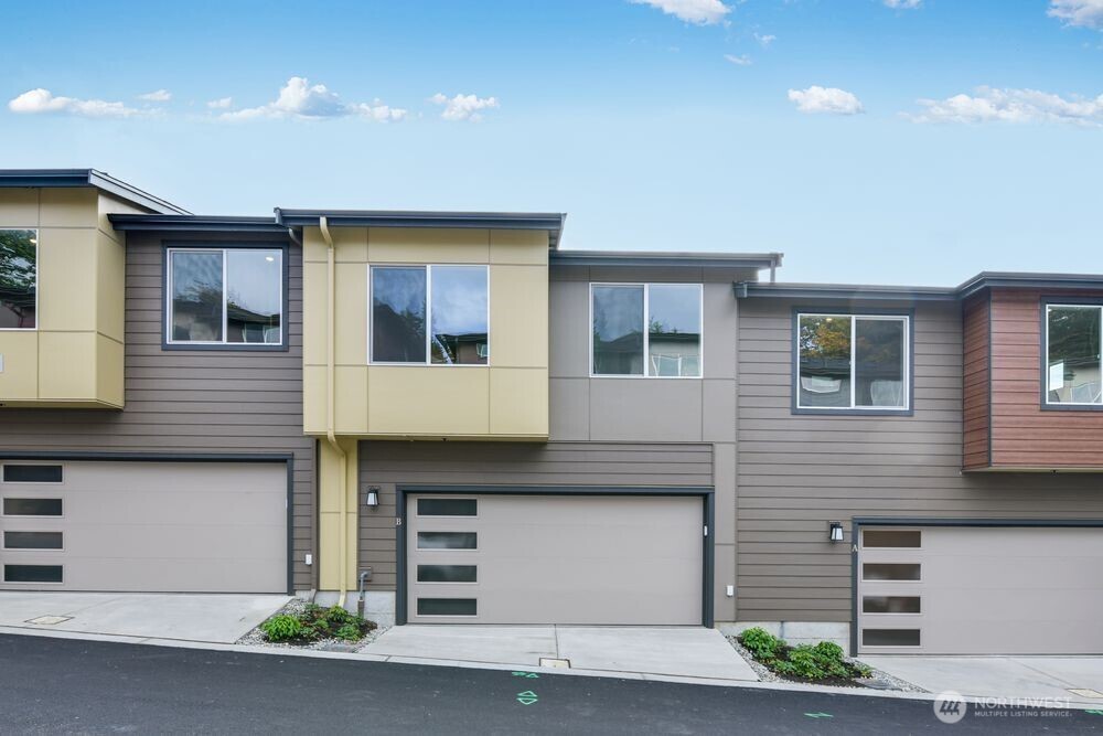 New Construction - Ready Now! Welcome to The A22 at 13211 NE 127th Way Unit B in Senderos. Step onto the charming lower-level porch and into a welcoming foyer with a cozy bedroom and full bath nearby. The main level features an open kitchen, dining area, and great room with sliding doors to a covered deck. Upstairs, a cheerful tech nook complements the serene primary suite with a spacious walk-in closet and private bath. Two additional bedrooms and a shared bath complete the upper level. Photos are for Representative Purposes Only. Builder broker registration policy requires, if represented, your broker register you with Community Site agent prior to OR with you, on your 1st visit. MLS#2442580