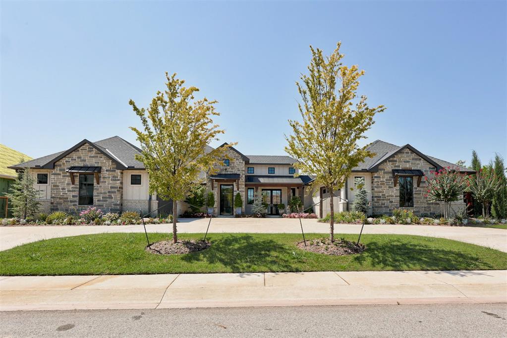 STUNNING Modern Farmhouse in coveted Black Oak at Iron Horse Ranch. Sitting on a spacious corner lot with amazing landscaping gives this home such lovely curb appeal. The unique wrap around front exterior discretely hides the TWO two car garages. A welcoming entry beckons you into the fabulous great room with amazing natural light; coffered ceiling; a floor to ceiling stone fireplace; and stunning view of the backyard oasis. Gorgeous wood floors adorn all the common areas of the home as well as the primary bedroom. A cozy dining space sits just off the kitchen, while the massive island offers two bar seating areas. The kitchen would make a pro-chef swoon with a commercial side by side frig/freezer; Thermodor 6 burner plus griddle cooktop & double ovens; farm sink; tons of storage & prep space and a walk-in pantry with coffee bar. The primary bedroom suite has a fireplace and spa-like ensuite bathroom with two vanities; soaking tub; shower with two shower heads and a bench seat; and two walk-in closets, one with a secret door into the kitchen pantry for your midnight munchies! There is a cozy office tucked away near the Primary bedroom suite for a quite space to work, read or craft. Three secondary bedrooms all have their own bathroom and their own thermostat. One of the secondary bedroom suites has direct garage access and back yard access creating a great multi-gen setup. Get ready to be everyone's favorite party house with the MASSIVE bonus room with wet bar PLUS a 13 seat theater room. The crowning glory of this magnificent property is the backyard oasis with sparkling swimming pool, hot tub, and outdoor kitchen. All the living areas wrap around the pool/courtyard creating a serene, private space to relax and regenerate. Outside TVs stay. Theater room projector stays. Schedule your private tour today!