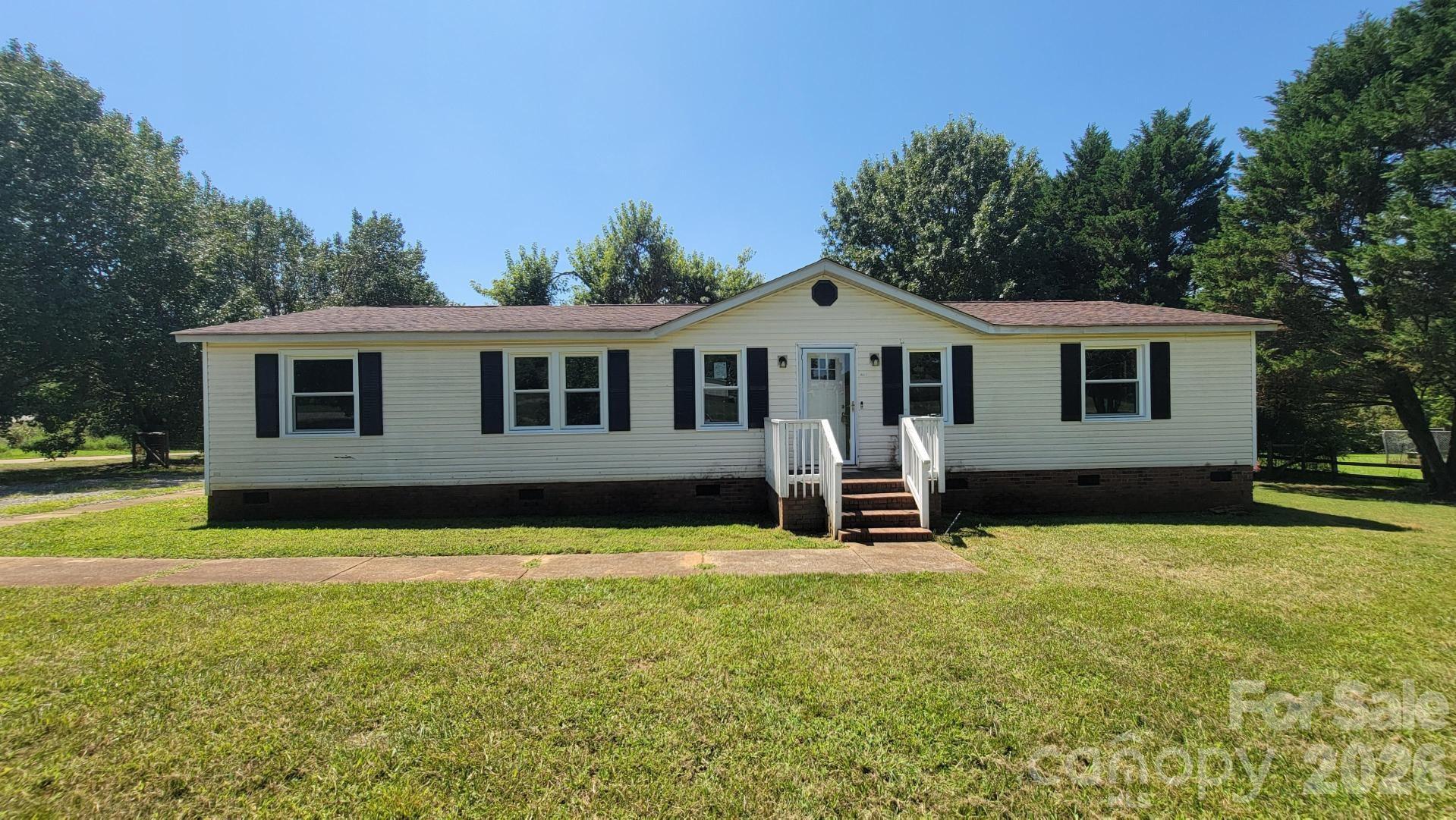 Outstanding opportunity for investors, DIYers, or buyers looking to build sweat equity! This 3-bedroom, 2-bathroom home sits on a private lot in Kings Mountain and offers fantastic potential. The interior features a cozy living room with a fireplace, a dedicated dining area, and a functional layout with a spacious master suite. Enjoy outdoor living on the back deck and peaceful surroundings. Property is being sold as-is—bring your vision and make this property shine!