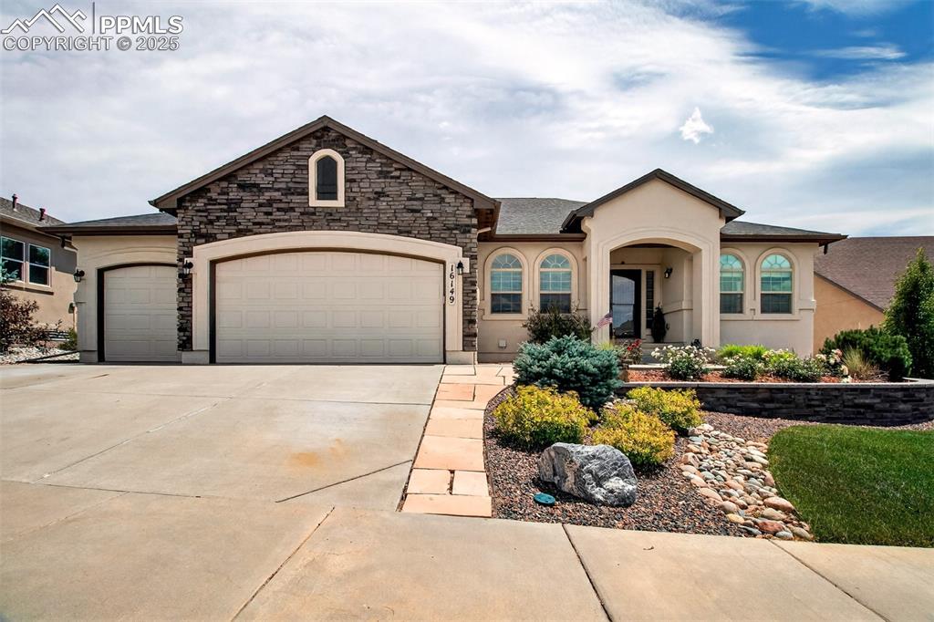 Welcome Home...  This very desirable Classic Home Grandby II model can be yours, in time for the holiday season!  You will love this beautiful ranch-style home offering 4 bedroom, 3 bathrooms and media room to complete this perfect floorplan for your family.  The open concept flows beautifully from the kitchen, kitchen nook with walk out to backyard, living room, and dining room, the main level has ample space for comfortable daily life and for entertaining.  The laundry is tucked in behind the kitchen with easy access to the 3 car OVERSIZED garage.  The main level offers the Master Bedroom with its own private 5-piece bath & walk in closet.  Another secondary bedroom on the main level is great for your home office or guest bedroom.  The kitchen offers plenty of UPGRADED cabinets and a pantry, the layout with the granite counter tops is a great space for holiday potlucks!  Bring your guests downstairs to enjoy the LARGE family room with wet bar for a fun night of games and conversation.  OR enjoy a night of Great Movies in the theater room!  Two additional bedrooms and a full bathroom make for plenty of space for all your friends and family! This wonderful neighborhood is close to Schools, Shopping, Hiking Trails, and parks. You will love the easy access to I-25 you can get to Denver in less than 1 hour.
 Schedule your showing to see this beautiful home, you do not want to miss out!