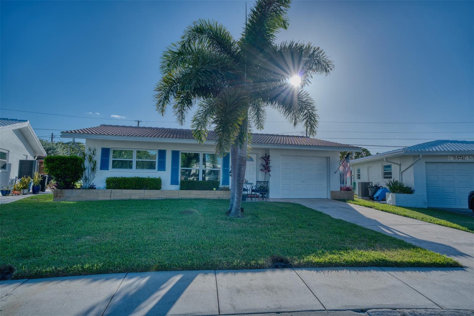Welcome to your coastal-style dream home in the highly desirable Mainlands of Tamarac, a vibrant 55+ golf-course community in the heart of Pinellas County. This beautifully renovated two-bedroom, two-bath home offers 1,097 square feet of bright, thoughtfully updated living space—and all the work has already been done for you.The home features new flooring throughout, a completely renovated kitchen with granite countertops and fresh coastal-inspired finishes, and two fully upgraded bathrooms with modern fixtures, vanities, and finishes. Laundry hookups add everyday convenience, while the attached one-car garage provides additional parking and storage. The light, relaxed interior creates the perfect Florida retreat—whether you are searching for a full-time residence or an easy seasonal getaway.This is truly a low-maintenance lifestyle. The community maintenance fee includes Wi-Fi internet, cable, water, sewer, trash service, lawn care, irrigation-system maintenance, exterior painting every five years, and roof maintenance—allowing you to spend less time worrying about upkeep and more time enjoying everything the community has to offer.Residents enjoy access to their own clubhouse and activity center, heated swimming pool, shuffleboard courts, social clubs, organized activities, and beautifully maintained common areas. Golfers will appreciate living within a golf-course community featuring the public 18-hole, par-67 Mainlands Golf Course.Conveniently located near shopping, restaurants, healthcare, major roadways, airports, and the Gulf Coast’s beautiful beaches, this home offers easy access to Clearwater, St. Petersburg, and Tampa.Completely renovated, move-in ready, and surrounded by exceptional amenities, 9610 45th Street North offers the carefree Florida lifestyle you have been searching for.