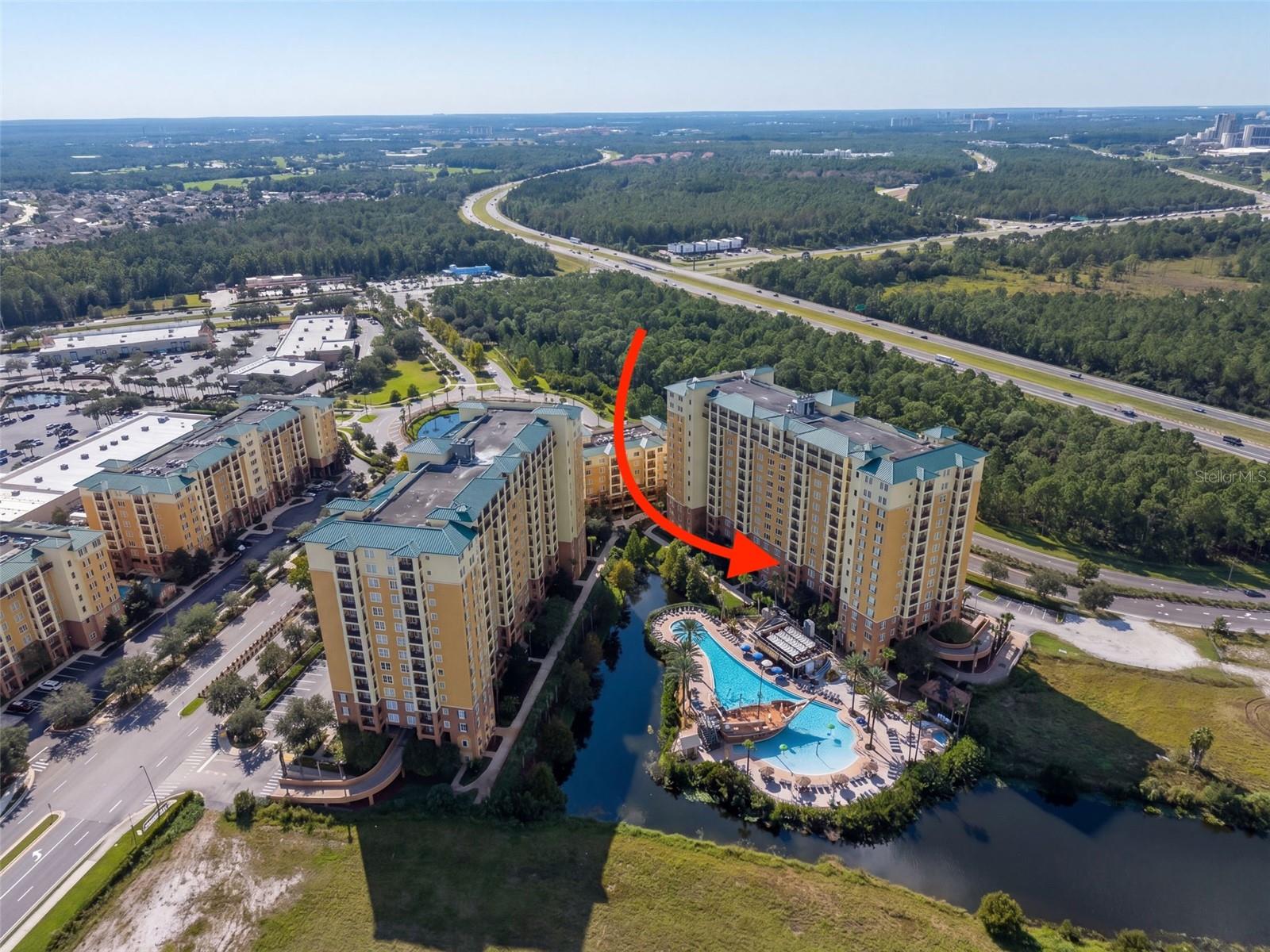 Experience turn-key Florida resort living with this fully furnished 2-bedroom, 2-bathroom condo situated on the 4th floor of Building 5 at the premier Lake Buena Vista Resort Village & Spa. Perfectly curated as a personal vacation getaway or lucrative income-generating investment property, the home features a light-filled open layout flowing seamlessly onto a private covered balcony. Step outside to unwind while enjoying peaceful, elevated views overlooking the community pool and serene pond—an ideal backdrop for morning coffee or evening relaxation.   Nestled in the heart of Orlando's top tourist corridor, owners and guests gain access to world-class resort amenities, including the famous Pirates Plunge zero-entry pool with a 61-foot pirate ship and water slide, a second quiet relaxation pool, the full-service Reflections Spa & Salon, a 24-hour fitness center, a game room, poolside dining, Frankie Farrell’s Irish Pub, Pizza Hut Express, and an on-site convenience store. Located just minutes from Walt Disney World, Universal Studios, SeaWorld, Disney Springs, and adjacent to the Lake Buena Vista Factory Stores, this prime address offers quick access to Central Florida’s finest attractions, dining, and shopping—making it an unbeatable investment opportunity for short-term rental revenue or seamless personal vacations.