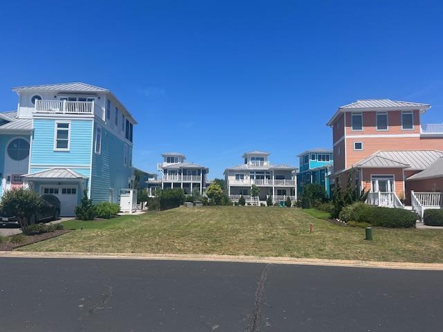 Beautiful building lot in Bay Creek's Marina Village.  Gated beach community located in the heart of Cape Charles.  Walk to private beach or quick golf cart ride to public beaches, restaurants, shops, and everything Cape Charles!  Waterfront restaurant and Marina within walking distance.  Design and build your beach home in this exquisite British West-Indies style community.