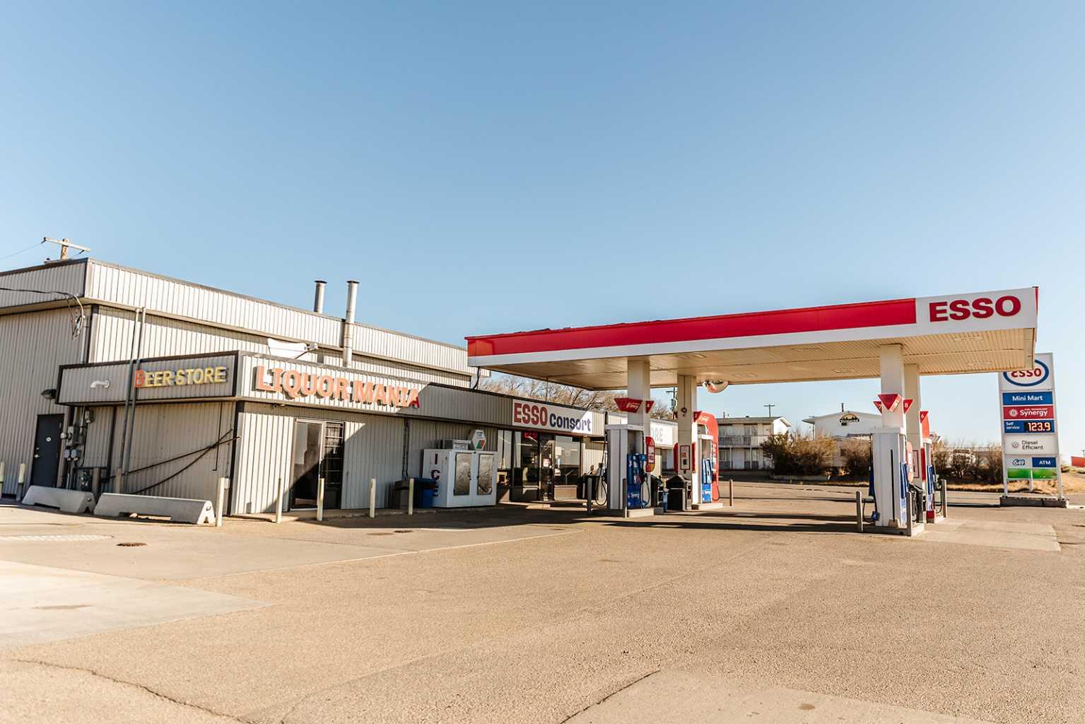 An exceptional investment opportunity in the heart of Consort! Positioned along the high-traffic Highway 12 corridor, this turn-key ESSO gas station features an established convenience store and a fully built-out liquor store — offering three potential diversified income streams in one location. Extensively renovated with over $400,000 in upgrades since 2013, including: Double-wall fiberglass underground fuel tanks, Upgraded fuel pumps & POS system, Energy-efficient LED lighting, Surveillance system & modern roofing, Convenience store & public washrooms remodel (2019), Newly constructed liquor store with walk-in beer cooler (2020). The gas bar is branded with ESSO’s Synergy fuel, and the interior showcases a bright, organized layout designed for maximum customer flow and product exposure. A separate, professional office space supports daily operations. This is a fully modernized, owner-operated business primed for both local traffic and highway travelers. Whether you’re an investor seeking passive income or an entrepreneur ready to be hands-on, this commercial property offers long-term growth in a growing region of Alberta. Strategic highway exposure, fully upgraded and operational, multi-income stream: fuel, C-store & liquor potential. A rare chance to secure a branded fuel franchise with full ownership of land and building.