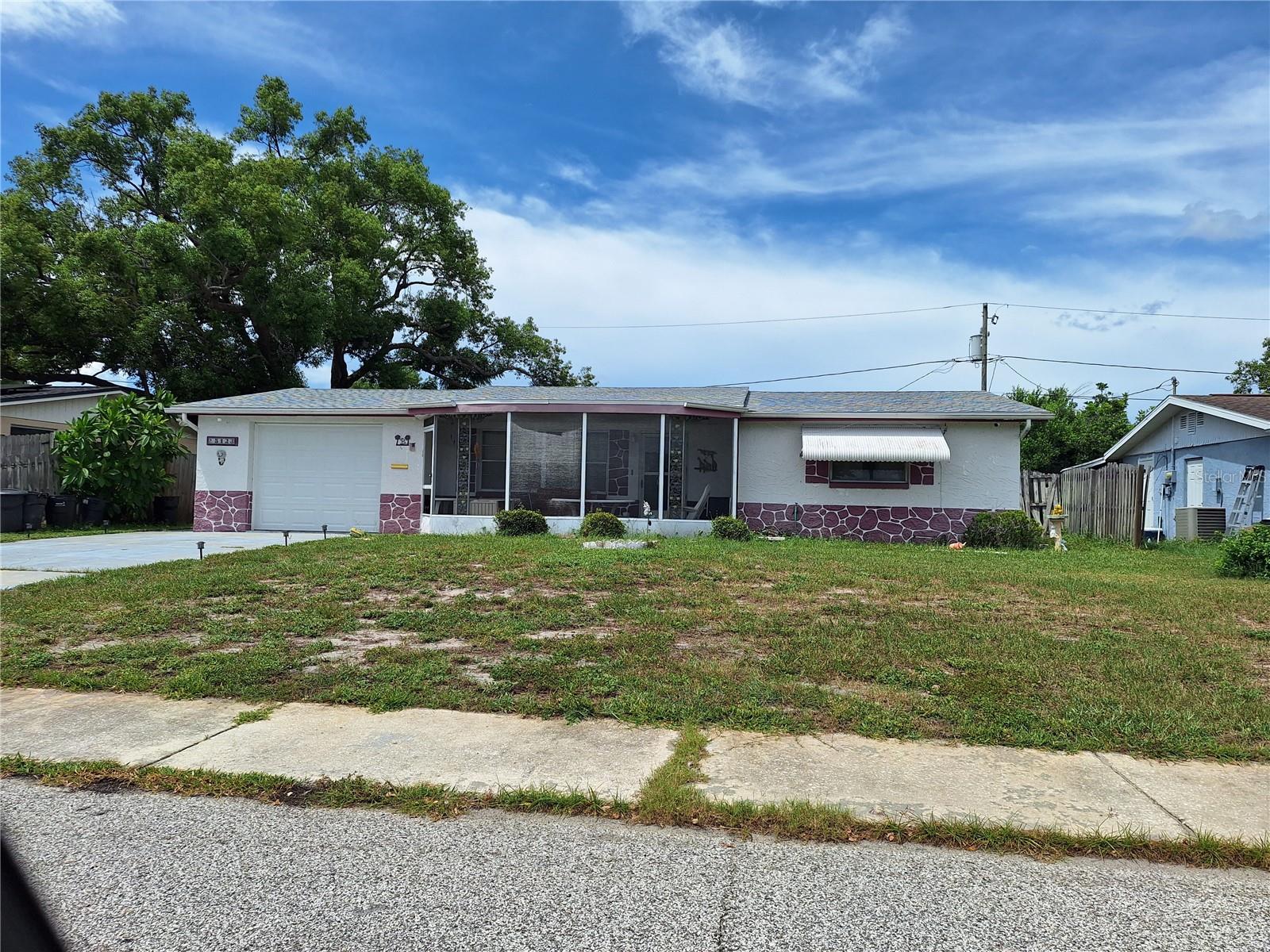 Incredible Colonial Hills Fixer Upper!! This 2 Bedroom, 1.5 Bathroom, 1 Car Garage Home has a Big Living
Room and also  a Large Family Room, a Galley Kitchen and Appliances. Fencing in Private Back Yard with a
Shed. The home had a New Roof in 2024, New A/C in 2023, Newer Garage Door, and  Septic System Clean
Out in 2019. Rear Yard has a Mosaic Tile Patio Slab, it was previously an Enclosed Screen Room that was torn
off during Hurricane last Summer. House is in an X Flood Zone, and in area of great schools! Big Bedrooms
and Cedar Closet in one! Tiled Garage Bathroom with Shower and Toilet has Wash Tub just outside bathroom
door. Most all major items have been completed already. Call today to see if you will be the next owner. 
Come give this home a fresh new interior!