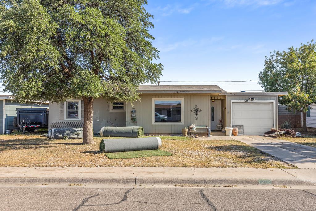 Spacious 3 bed 2 bath home with oversized primary suite, updated tiled shower, and stainless in-wall oven with warming drawer. Hardwood floors, open living areas, and large windows bring natural light throughout. Situated on a .174 acre lot with a big backyard, patio space, and storage shed. With paint, flooring, and your finishing touches, this home offers plenty of opportunity in a central location. Bring your vision!