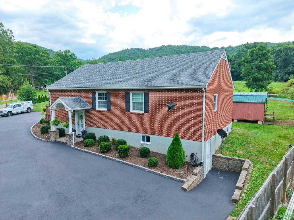 Well-maintained brick ranch located in the Riner VA community and Auburn school district! This home offers over 1,600 sq ft of finished living space with 3 bedrooms and 2 full baths, including a portion of the basement that has been finished for additional living area. The home was remodeled in 2009 and has been well cared for over the years. Features include a paved driveway, attractive landscaping, privacy fencing, garden space, an outdoor storage building and an above-ground pool. The shingle roof was replaced in 2020. A solid home in a convenient Riner location with plenty of space inside and out!