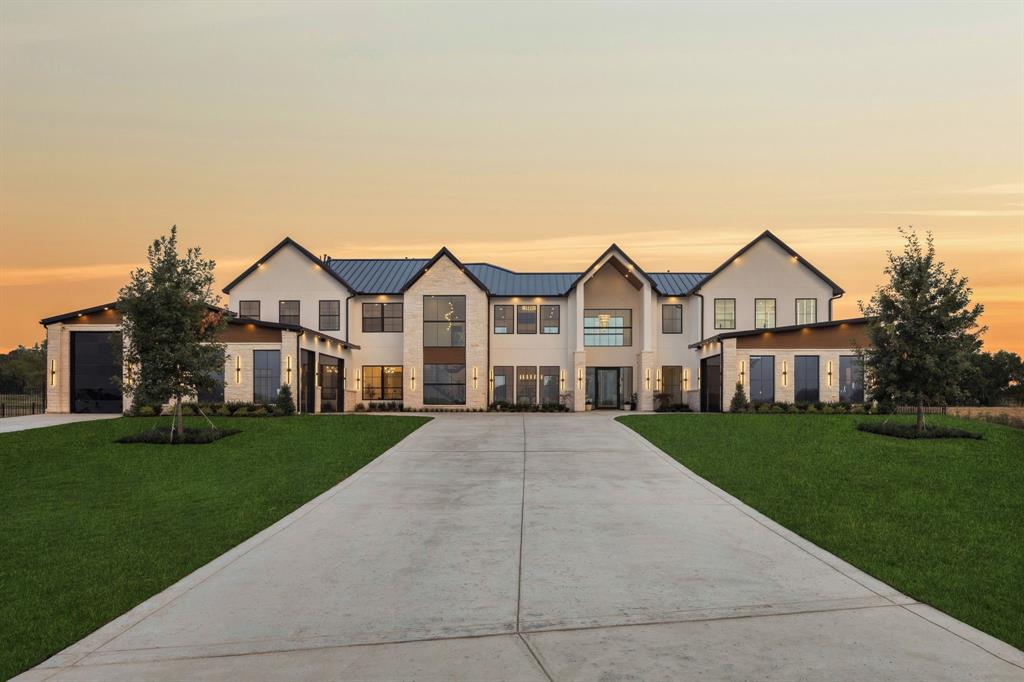 Welcome to an architectural triumph in Bartonville’s prestigious Eagle Ridge, where 8,243 square feet of exceptional design and craftsmanship set a new benchmark for luxury living. Perfectly positioned onjavascript:__doPostBack('m_lbSubmit','') over 2 acres, this 6-bedroom, 7-bath estate—with 2 additional half baths—delivers an unmatched blend of sophistication, comfort, and lifestyle amenities. Step inside to soaring spaces and exquisite finishes, where every detail has been thoughtfully curated. Control 4 system throughout for lights and music. The home’s heart is a chef’s dream, featuring double kitchen islands topped with Taj Mahal quartzite, dual Wolf ranges, dual Sub-Zero refrigerators, a Miele espresso machine, and a fully appointed butler’s pantry with a secondary Wolf range. Entertain in style in the cinema room with a twinkling star ceiling, the spacious game room, or multiple sitting areas warmed by gas see-through fireplaces. The primary suite is a private sanctuary with a two-story LED-lit closet with center island, a steam shower, and resort-caliber finishes. Unique touches include a pet wash room, temperature-controlled wine room, and multiple garages—including a 3-car garage and 2-car garage each with dual Tesla chargers, plus a 40’ RV garage or multiple car lifts for the car enthusiast. Outdoors, an infinity-edge jacuzzi, temperature-controlled pool with lighting, and sunken lounge area invite year-round relaxation. A fully equipped outdoor kitchen with gas grill, fridge, and griddle makes alfresco entertaining effortless. Turf lawns and a private pond complete this idyllic retreat. Set within Eagle Ridge’s coveted enclave—zoned to Argyle ISD and near Liberty Christian School—residents enjoy scenic community ponds, proximity to renowned dining such as Marty B’s, premier golf at Denton Country Club and Lantana Golf Club, and the sparkling waters of Lake Lewisville and Lake Grapevine.