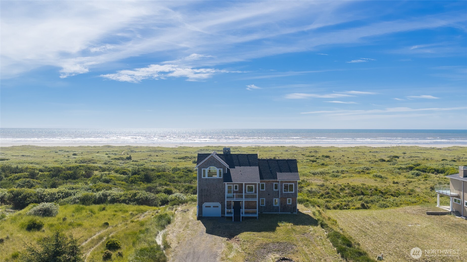 OCEAN FRONT DREAM HOME with 2,903 sq.ft.! This tri-level home features gorgeous Ocean Views from every level in this 1-Owner Custom Built Home. The extra tall ceilings and large windows grace this home to offer the maximum amount of Ocean, Dunes & Sunset views. Enter into the main floor w/ a large Game Room (yes, it comes with the pool table & arcade games), 2 BD, 1 full-BA, and access to the Backyard & Path to the Beach. Head up the spacious Bamboo floor staircase to the Large Open Great Room ~ all with breathtaking Ocean Views & Bamboo flooring: Living Room, Dining Room, Kitchen, Kitchen Nook. The Kitchen features stylish slab granite counters w/ an Island, newer SS Appliances, propane range, and light cherry wood cabinets. The wood-burning Fireplace is the eye-catching feature w/ a raised hearth & stone facade. Enter into the South-wing of the home w/ all new LVP Flooring: Large Master BD w/ wonderful Ocean Views and a jetted tub; 3/4-BA; door to the Covered Front Deck; and head-up the stairs to the 3rd-level -- WOW! This spacious Bonus Room features amazing Ocean & Dune Views, vaulted ceilings, and a stylish wood-burning Fireplace similar to the one in the LR. FULLY-FURNISHED. Exterior was remodeled in 2023: new siding, trim, doors, windows. New garage door & heat pump in 2026. Can you imagine owning this amount of space w/ approx. 100' of Ocean frontage for Under $1M on the Pacific Ocean? Here is your chance. Can be used as a vacation rental (will need permit from GHC).