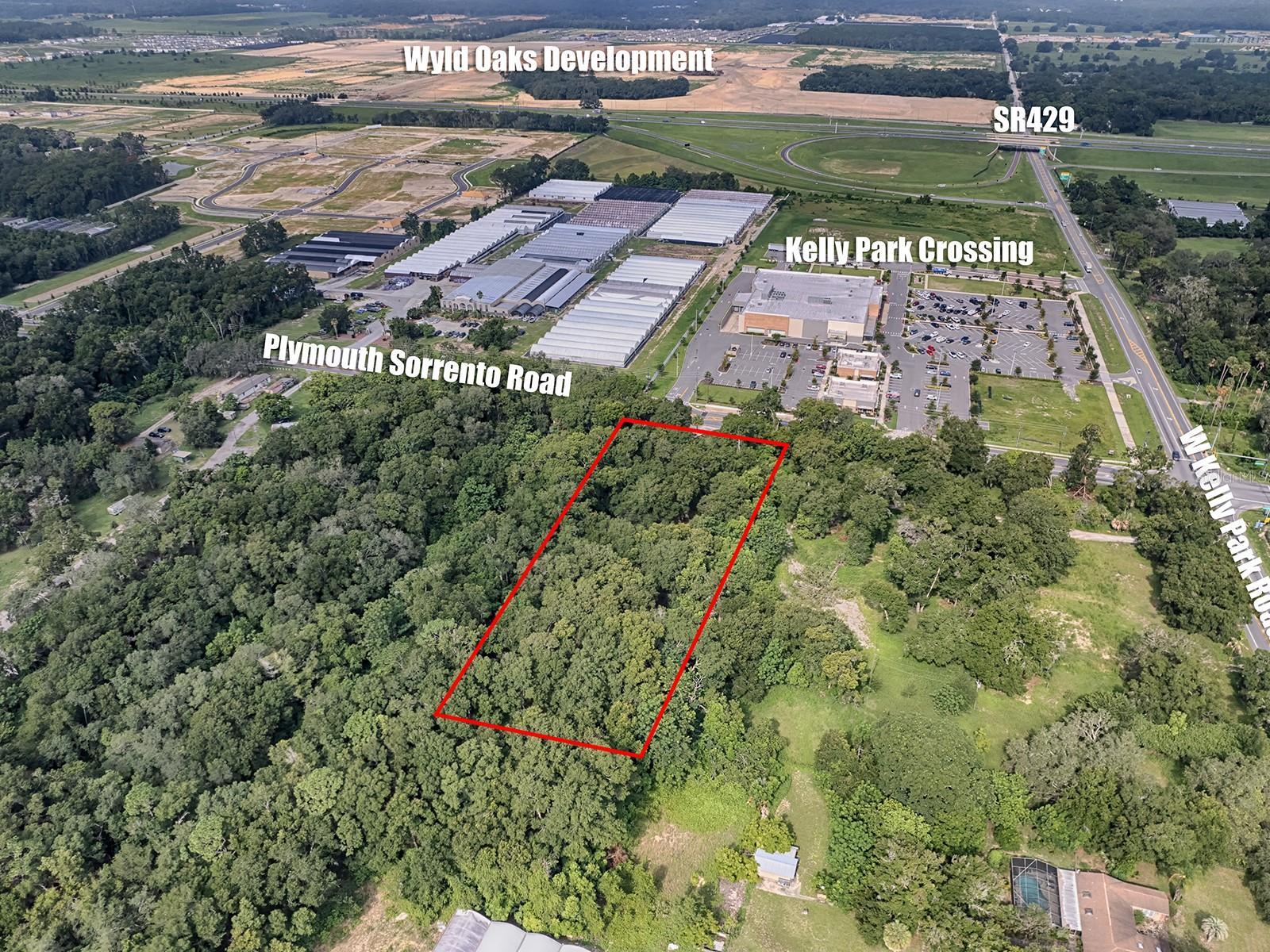 PRIME DEVELOPMENT OPPORTUNITY: 2.58+/- ACRES WITH MIXED-USE ZONING OPTION IN THE "VILLAGE CENTER" DISTRICT OF THE KELLY PARK INTERCHANGE(KPI), APOPKA, FL 32712. Located at Kelly Park & Plymouth Sorrento Roads, this development parcel is contiguous to the new AdventHealth free-standing Emergency Room located on the corner and situated in the highly desirable East "Village Center" of the Kelly Park Interchange Mixed-Use Zoning District. With 165' of direct frontage on Plymouth Sorrento Road, this parcel is flat & level needing minimal site & clearing work, City Water/Electric/Internet/Phone at Site, Excellent Ingress/Egress, Daily Traffic of 20,700+ (AADT), Apopka, FL 32712 has high-income households ranking 26% above the average for Orange County. This property is also just 1/4 mile from the $1.2 billion development of Wyld Oaks currently underway that included 280,000 s/f of Retail & Outparcel space, 200,000 s/f of Office space, 70,000 s/f Restaurant space, Two Hotels, up to 4,000 Multifamily & Condominium residences, an Expansive Outdoor Entertainment Venue, as well as multiple green spaces. Permitted uses allowed under the MU-KPI include: Restaurants, Bars, Lounges, Taverns, Retail Sales & Service, Financial Institutions, Outpatient Care Facility, Medical/Dental/Research Clinics & Laboratories, Professional/ Medical/Business Offices & Studios, Hotels, Child Care Facilities, Fitness Centers & Gyms, Theatre’s (Movies & Plays), Arts and Performing Arts & Crafts Studios, Art Gallery/Museum & Other Cultural Facilities, Recreational Indoors (Bowling Alley, Billiards & similar uses), Parks & Recreational Facilities (Private), Animal Boarding, and Multi-Family Dwellings. Additional “Special Exception” permitted uses: Church or Parish Houses, Community Center/Civic Clubs, Nightclubs, Restaurants w/Drive-thru Facilities, Schools (Public & Private), Bed & Breakfast, Parking (Garage & Surface) and others. Contact the Listing Broker for more information or request the full Offering Memorandum that includes full property profile, highlights and details.