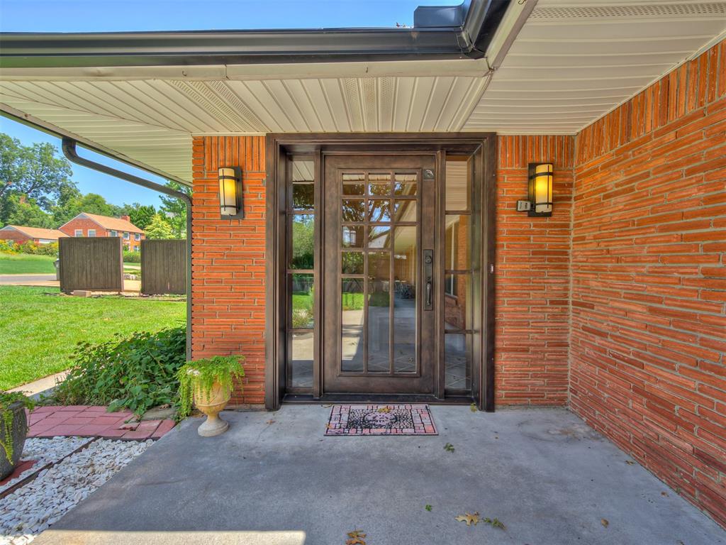 Timeless mid-century remodel on just over half an acre, located on the west side of campus and within walking distance to the University of Oklahoma. Perfect for professors, students, or anyone wanting to enjoy the convenience of campus life and the excitement of game day activities. This beautifully updated home features bamboo flooring throughout the main living spaces and an open-concept layout that seamlessly connects the living, dining, and kitchen areas. Oversized windows flood the home with natural light and offer peaceful views of the massive backyard shaded by mature trees. The property includes a large dedicated office and a huge studio space—ideal for creative work, a home gym, or a potential guest suite. The expansive backyard is perfect for entertaining, relaxing, or gardening. Rare combination of timeless design, thoughtful updates, and unbeatable location. Just minutes from Campus Corner, shopping, and dining. Schedule your tour today.
