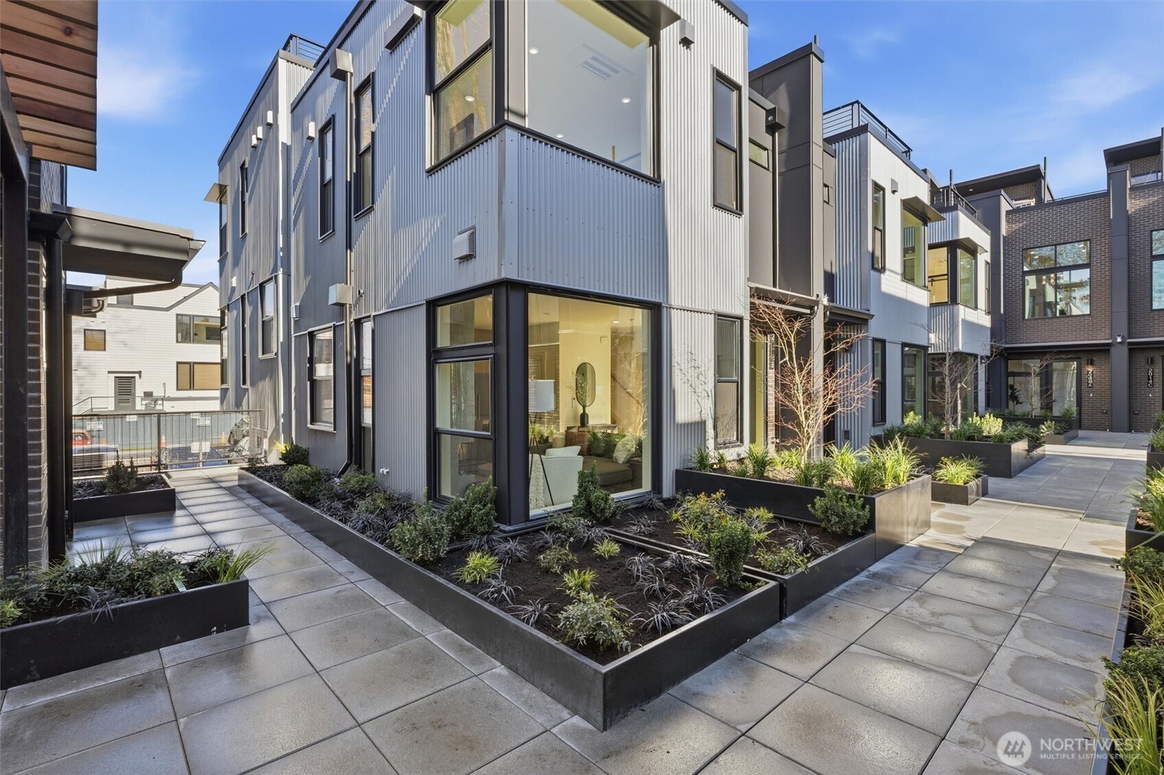 Harbor 26 isn’t just an address, it’s a front-row seat to Lake Union. This 26 home community is located in the coveted Eastlake enclave set directly across from the shoreline, where modern architecture meets an easy waterfront rhythm. Nestled within a gated community, these beautifully designed 1-4 bedroom homes offer smart, open layouts filled with natural light and elevated finishes throughout. Enjoy water views from inside some of the homes themselves, where sailboats and city reflections become part of your everyday backdrop. Upstairs, your private rooftop deck showcases sweeping panoramic views of Lake Union and Seattle’s iconic skyline—sunsets glow, city lights sparkle, and every gathering feels a little more memorable. There are 20 parking spaces in a secured garage, offering both convenience and peace of mind. Harbor 26 is brought to you by DEP Homes Eastlake, a distinguished local developer with over two decades of experience shaping Seattle’s residential landscape through thoughtful design, lasting quality, and a commitment to refined urban living. Modern. Waterfront. Secure. Unmistakably Eastlake.