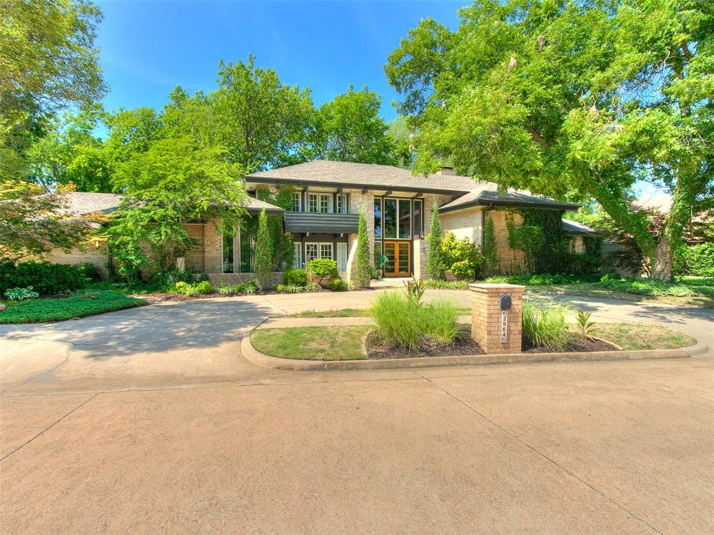 Welcome to a truly one-of-a-kind home. Nestled in a private wooded retreat, close to campus, this Van Fullerton home was redesigned by Designs by Davis in 2021. This Scandinavian inspired designed home boasts nearly 5,000 sf and overlooks more than an acre of mature trees. The two story primary suite includes an office space, two walk in closets, a balcony, covered patio and a spa-like, luxury primary bathroom designed for two. This chef’s kitchen has breath-taking views and features a 36” Fisher & Paykel gas range, built-in second oven, side-by side-refrigerator and freezer and 9’ island. A second primary suite could serve as a mother-in-law suite with full bath and private entrance. Upstairs has a theater room, three bedrooms and two bathrooms. And while you may never want to leave your home, what makes this home truly special is the peaceful private retreat in your own backyard. Morning walks on the trail among the mature trees, or relaxing in a hammock, you’ll find yourself outside loving your own backyard. The land is a separate legal lot from the main house, giving you the flexibility to build a second home, perfect for a mother-in-law setting. This land is surrounded by a bird sanctuary on two sides creating total privacy. Experience all that Norman has to offer being walking distance to the Lloyd Noble Center, Love’s Field, and the Sam Noble Oklahoma Museum of Natural History. Owner/agent.