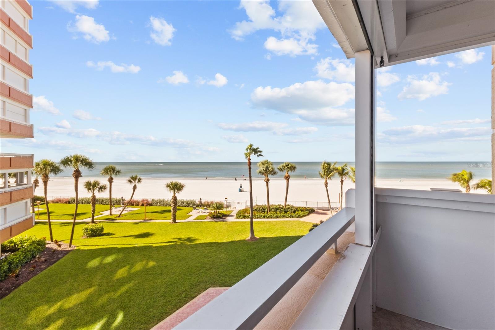 JUST IMAGINE Opening your eyes each morning to GULF VIEWS, & END YOUR Day with SPECTACULAR SUNSETS!  This IS THE BEACH LIFESTYLE YOU'VE been DREAMING ABOUT!  From Your Private Balcony sip your morning coffee with a gentle coastal breeze. The sky transforms into brilliant colors as the sun sets over the water. Welcome to REDINGTON TOWERS II!LOCATED ON THE BEACH SIDE WITH DESIRABLE SOUTHWEST GULF VIEWS, this beautifully UPDATED, FULLY FURNISHED with a KING Sized Murphy Bed, 1,060-square-foot condo offers the perfect coastal escape. Step inside to discover a bright, spacious OPEN Living & Dining area  featuring Ceramic Tile flooring, attractive BEAMED ceilings, Recessed lighting, and thoughtful updates throughout.The Kitchen features WHITE BEADBOARD CABINETRY, GRANITE COUNTERTOPS, STAINLESS STEEL APPLIANCES, a GLASS BACKSPLASH, and a BRAND-NEW FLAT-TOP (2026).  Additional features include IMPACT-RATED SLIDING DOORS, REMOTE-CONTROLLED ELECTRIC BALCONY SHUTTERS, NEW A/C in 2022, and Water Heater (2018).The primary bedroom offers a walk-in closet, Balcony access & a PRIVATE ENSUITE BATH with a TILED WALK-IN SHOWER, SOAKING TUB, and GRANITE VANITY. A SECOND HALF BATH adds convenience for guests.  LOVE HAVING GUESTS? HERE'S A CLEVER SURPRISE! A stylish KING SIZED MURPHY BED with a discreet privacy curtain provides comfortable guest accommodations without sacrificing your living space. Simply tuck it away when not in use!  The BALCONY, which is accessible from both the Living room & Bedroom, is perfect for enjoying Gulf breezes, watching boats, Dolphins, beachgoers, seasonal fireworks and those AMAZING SUNSETS! BONUS — enjoy INTRACOASTAL VIEWS to the southeast!  RESORT-STYLE LIVING! This GATED, GULF-FRONT COMMUNITY offers a HEATED POOL, FITNESS center, Covered Parking, storage, EV charging, clubhouse, movie room, billiards, and more!  The monthly fee includes cable, internet, water, sewer, trash, insurance, and exterior and grounds maintenance. Recent community improvements add to the appeal.WANT RENTAL FLEXIBILITY? Building II allows rentals with a 3-MONTH MINIMUM, offering the opportunity to enjoy your beach getaway while potentially generating rental income when you're away, subject to association rules.  Restaurants, shopping, and entertainment are conveniently nearby.  SUNSETS. GULF BREEZES. BEACH WALKS. AND A FULLY FURNISHED PLACE TO CALL YOUR OWN! Whether you're looking for a seasonal getaway, full-time residence, or second home with rental potential, THIS IS YOUR OPPORTUNITY TO LIVE THE BEACH LIFESTYLE!