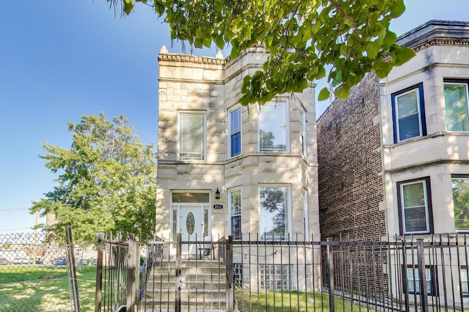 THIS DESIGNER-CALIBER, LIGHT-FILLED HOME SITS ON A QUIET ONE-WAY STREET IN THE HEART OF WOODLAWN, JUST MINUTES FROM THE UNIVERSITY OF CHICAGO, MT. CARMEL, LAKE MICHIGAN, MULTIPLE PARKS AND CONVENIENT PUBLIC TRANSIT, RETAIL, AND DINING OPTIONS. OFFERING 4 BEDROOMS AND 3.5 BATHROOMS, THE HOME FEATURES A SOUGHT-AFTER LAYOUT WITH 3 BEDROOMS/2 FULL BATHROOMS UP W/ CONTEMPORARY FINISHES THROUGHOUT, INCLUDING HARDWOOD FLOORS AND LARGE WINDOWS THAT FILL THE SPACE WITH NATURAL LIGHT. THE CHEF'S KITCHEN SHOWCASES WHITE SHAKER CABINETRY, QUARTZ COUNTERTOPS, STAINLESS STEEL APPLIANCES AND A SPACIOUS ISLAND WITH SEATING. THE OPEN DINING AREA FLOWS FROM THE KITCHEN, CREATING AN IDEAL SPACE FOR EVERYDAY LIVING AND ENTERTAINING. THE LUXURIOUS PRIMARY SUITE SERVES AS A PRIVATE RETREAT WITH A JULIET BALCONY, PROFESSIONALLY ORGANIZED CLOSET, AND SPA-INSPIRED BATHROOM. THE LOWER LEVEL OFFERS EXCEPTIONAL VERSATILITY WITH A LARGE REC ROOM FEATURING CUSTOM BUILT-INS, AN ADDITIONAL BEDROOM PERFECT FOR GUEST/OFFICE/EXERCISE ROOM; A FULL BATHROOM WITH SHOWER, AND AMPLE STORAGE. OUTDOOR LIVING IS JUST AS IMPRESSIVE W/ A REAR DECK IDEAL FOR ENTERTAINING, OVERSIZED TWO-CAR PARKING PAD WITH DIRECT ACCESS TO THE HOME.