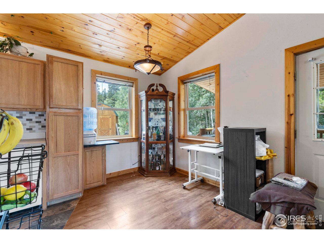 Escape to the mountains in this charming 2-bedroom, 1-bath log-sided cabin nestled in the desirable Crystal Lakes Community. Built in 2002 and thoughtfully updated, this year-round accessible retreat offers a cozy interior with new engineered hardwood flooring, new tile, a stylish kitchen stone backsplash, new cabinets and recent upgrade to gas stove. Enjoy the warmth and charm of a wood-burning stove beneath the vaulted wood-panel ceilings, or step outside to relax on the covered deck with brand new railings and soak in the peaceful surroundings. Set on a half-acre lot, this property offers the ultimate mountain lifestyle-often visited by moose, hummingbirds, and other local wildlife. National forest and the community lake are only minutes away. The 1,000-gallon water cistern supports comfortable living, while forced air heating ensures you stay warm during the colder months. A fire pit invites you to gather under the stars, and the Sellers are generously leaving all firewood for both the stove and the pit. Bonus features include a shed and dog run-ideal for pets and additional storage. Whether you're looking for a full time residence or weekend escape this mountain gem delivers comfort, charm, and access to nature right at your doorstep. FYI...HOME WAS WITHDRAWN DUE TO WINTER MONTHS AND ACCESSIBILITY TO THE PROPERTY. DAYS ON MARKET show longer than usual due to this. CONTACT AGENT FOR ANY QUESTIONS.