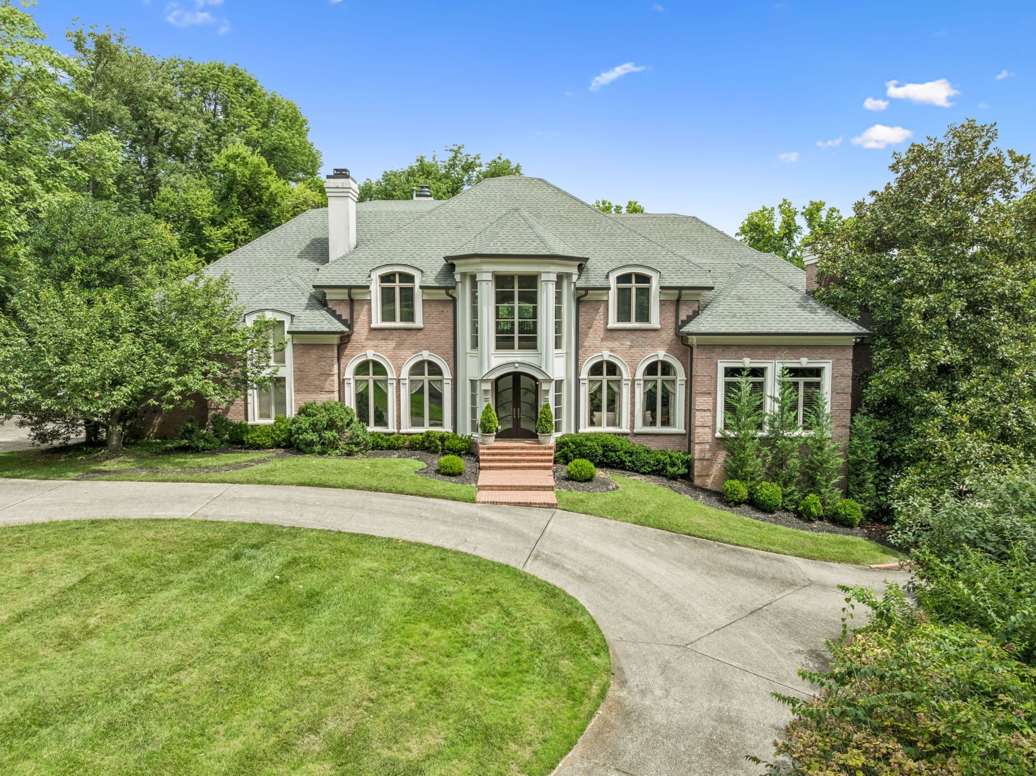 Situated on over 2.6 acres on one of Oak Hill’s highly sought after streets! Property is like a park with big, old-growth trees and privacy. Secluded 18' x 40' saltwater pool with travertine stone deck. House designed for ease of entertaining inside and outside. Two story kitchen with eat-in center island includes 72 inch SubZero refrigerator /freezer, Wolf double ovens, KitchenAid warming drawer and indoor grill with commercial exhaust fan. Main level owner's suite with sitting area. Large master bathroom- DBL vanities, 2 closets, heated floors, shower, jacuzzi and coffee bar. Large wood paneled study on main level. Banquet sized dining room with adjacent butler’s pantry. Two laundry rooms. Basement with kitchenette, media room, rec area, exercise room, bathroom and sleeping area. Separate sports practice area for golf and soccer. Each bedroom features a bath. Built-in speakers in walls and ceilings throughout the house. Light filled home with walls of windows. Oversized rooms. Six fireplaces. Four car garage, one bay is adjacent to kitchen. Storage everywhere. Fifteen minutes to airport***Showings by appointment only~ Thank you***