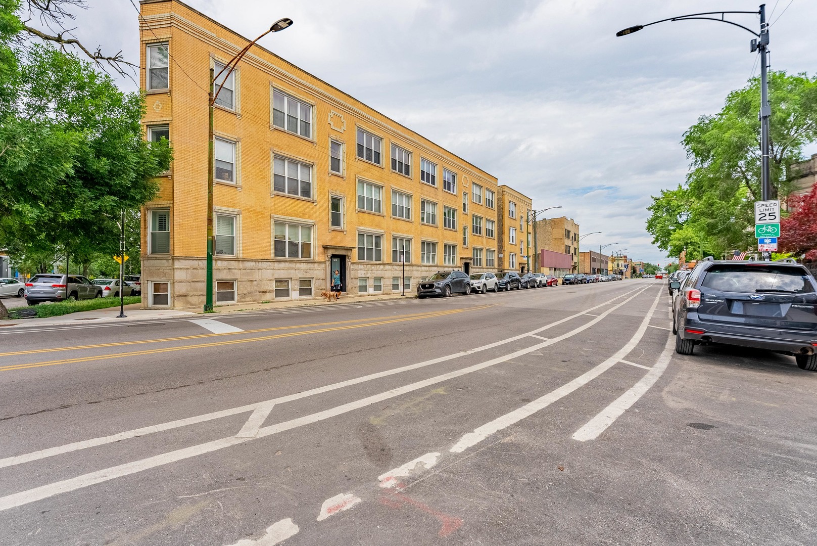 Nestled in the heart of Logan Square at the soon to be newly redesigned Milwaukee-Kedzie traffic circle, this beautifully updated two-bedroom, one-bathroom condo blends modern finishes with classic Chicago charm. Hardwood floors flow seamlessly throughout, leading you into an open-concept living area anchored by a granite-topped breakfast bar and stainless-steel appliances. Crown molding and tall ceilings add an airy sophistication, while the marble-tiled bath and in-unit washer/dryer bring everyday luxury and convenience.    Step outside onto your private back deck-perfect for summer grilling or morning coffee-and take in the tree-lined boulevard. Built of solid brick and thoughtfully maintained, the building offers an extra storage locker, a secure bike room, and easy street parking (city permit). Less than a block from the Blue Line at Kedzie, you're moments from downtown or O'Hare.    Logan Square's legendary dining and nightlife are right at your doorstep: grab brunch at Same Day Cafe or Cafe Con Leche, craft cocktails at El Cid, or a farm-fresh dinner at SABA Italian. Longman & Eagle and Lula Cafe are just across the street, while the Logan Theater and one of the city's best farmers markets on Logan Boulevard are mere steps away. Outdoor enthusiasts will appreciate quick access to the 606 Trail for walking, running, or biking, and the upgraded traffic circle now boasts safer crosswalks, enhanced green space, and smoother traffic flow-making neighborhood strolls and weekend adventures easier than ever. Welcome home to 2716 N Kedzie #2, where community, convenience, and character come together.