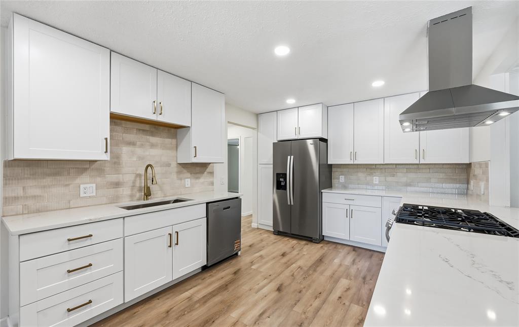 COMPLETELY RENOVATED SINGLE-STORY ON OVER A THIRD OF AN ACRE! This stunning home showcases a perfect blend of thoughtful design & sleek modern finishes, offering fresh paint, updated bathrooms, vaulted ceilings, oversized secondary bedrooms, and a floor-to-ceiling brick fireplace. Elevate your culinary game in the beautifully remodeled kitchen boasting quartz countertops, stainless steel appliances, white cabinets with modern hardware, a refrigerator, and gorgeous backsplash. Work comfortably from home in your office with built-in bookshelves, or end your day in the large primary suite graced with a dual sink vanity, semi-frameless shower, and a walk-in closet. Unwind in the light and bright sunroom, curl up with a good book on the cozy front porch, or host weekend barbecues on the covered patio. There’s ample room for parking with a circle driveway plus a spacious 2-car garage with abundant storage space. Other features include a recently replaced roof, HVAC unit, windows, light fixtures, ceiling fans, light switches and outlets, flooring, and interior doors. Close to plenty of shopping and dining options, including Allen Premium Outlets, with quick access to 75 and 121 for an easy commute. Take a first-person look at this gorgeous home! Click the Virtual Tour link to see the 3D Tour!