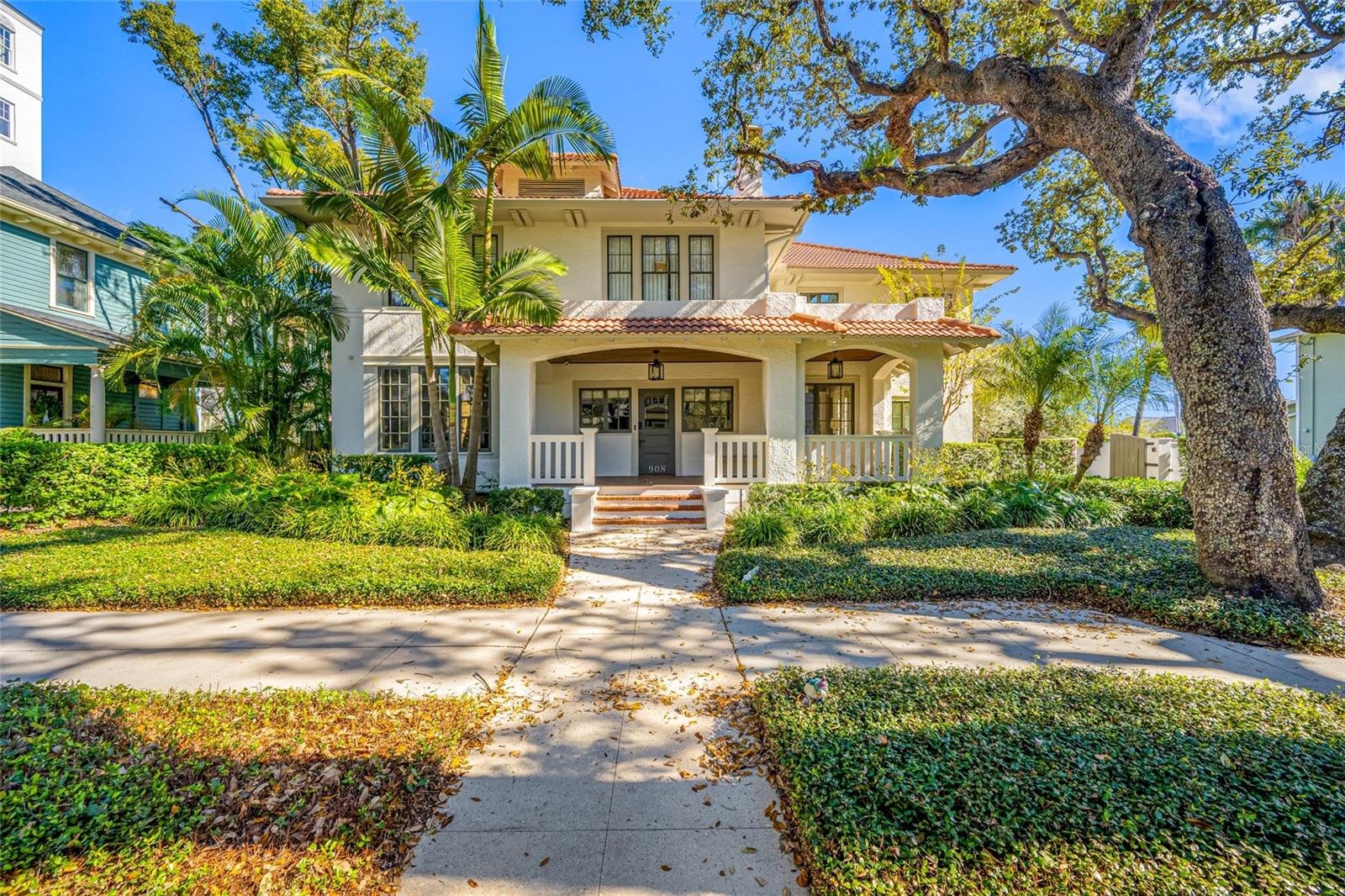 Situated in one of Hyde Park’s most coveted locations, this exceptional South Tampa residence offers a rare blend of timeless architectural charm, refined luxury, and everyday livability. Located in a non-flood zone, the home provides a sense of privacy and permanence while remaining just moments from Hyde Park Village, Bayshore Boulevard, premier dining and shopping, and top-rated Plant High School.Inside, a warm and inviting atmosphere is defined by white oak flooring, custom millwork, and multiple fireplaces. Designed for both entertaining and daily living, the chef’s kitchen features marble countertops, custom cabinetry, Miele appliances, Sub-Zero refrigeration, an oversized island, and a spacious walk-in pantry. Additional interior highlights include formal and casual living spaces, a stylish wet bar with 120-bottle wine storage, a mudroom, and a convenient first-floor en-suite bedroom. The owner’s suite is a private retreat, complete with a fireplace, balcony, custom walk-in closet, and spa-inspired bath with steam shower. Additional guest suites and an upstairs laundry room add comfort and practicality.Outdoor living is equally impressive, featuring a full-length covered veranda with phantom screens, a Wolf outdoor grill, heated saltwater pool and spa, outdoor shower, and lush landscaping. A standout feature is the detached 2-car garage with private guest quarters, complete with a kitchenette, full bath, and dedicated pool bath, ideal for guests, in-laws, or extended stays.This is a rare opportunity to own one of Hyde Park’s finest luxury residences, offering elegance, comfort, functionality, and an unbeatable location.