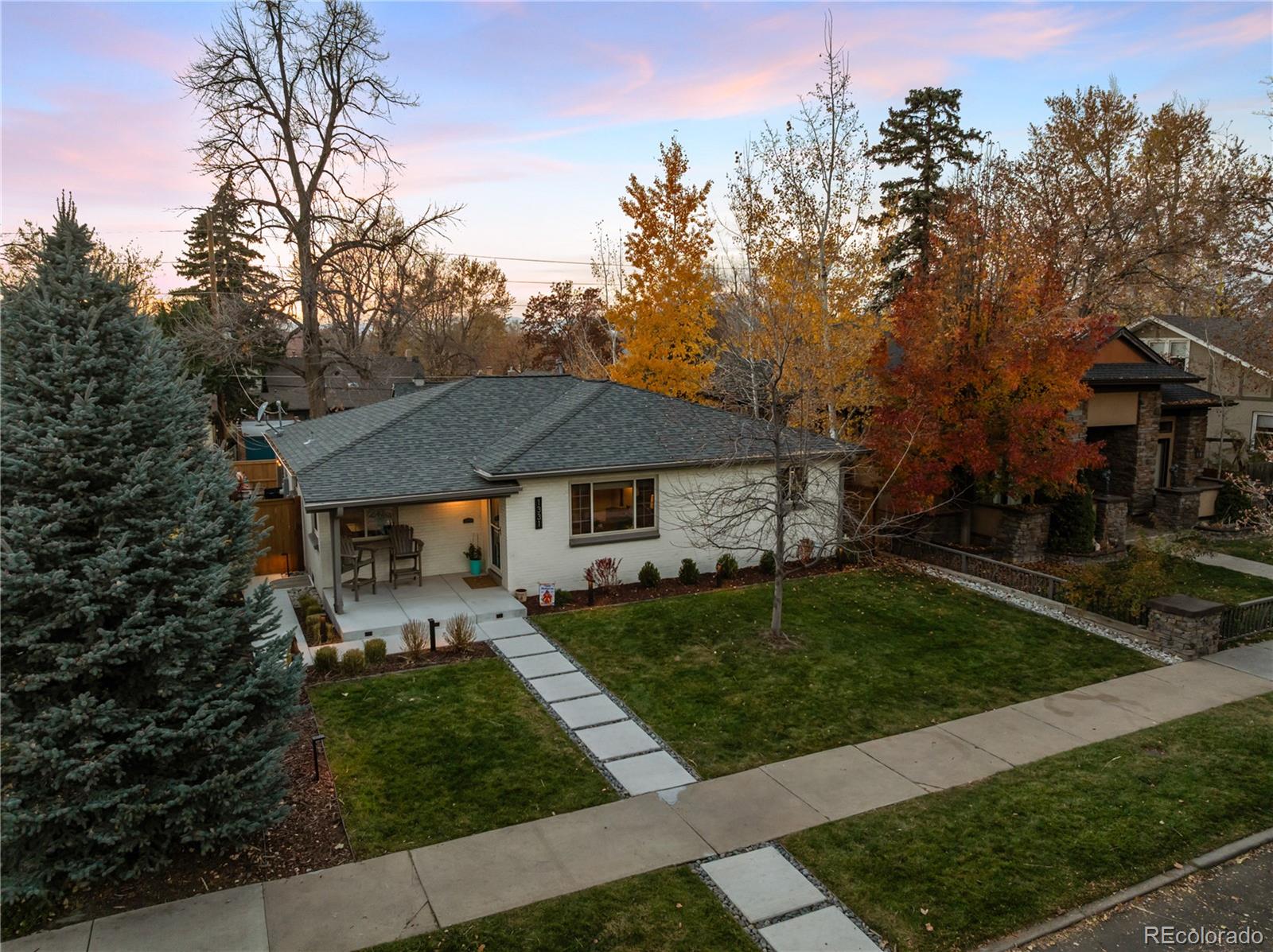 Gorgeous 1331 South Gaylord Street and you will immediately feel at home. This 4 bed, 3 bath property offers 2 living spaces and a home office. Located on a double lot in East Wash Park, this beautifully remodeled property is just what you’re looking for! The main level is bright and airy, allowing great natural light from picture window overlooking the grassy front yard. Unique tray ceiling and crown molding. Living room connects to the dining area home to future family dinners and holiday feasts. The white kitchen is a chef’s dream with quartz counters, plenty of cabinets, and stainless steel appliances including a gas range. A spacious office with French doors. The primary bedroom is down the hall with walk-in closet and ensuite bathroom with oversized shower. A secondary bedroom is opposite with full bathroom off the hallway. The lower level was recently renovated and includes a second living space with beverage center, two more bedrooms with egress windows, shared 3/4 bath. Plenty of storage in a dedicated room that spans the length of the home. The laundry room/pantry has additional space. Washer/dryer included. Newly upgraded backyard is a dream. Watch the sunset beneath the pergola next to the gas firepit, custom outdoor kitchen beneath the covered patio. The artificial turf keeps water costs low, maintenance a breeze, and the grass is always green(er). The oversized two car garage has tons of storage and an attic. A driveway provides additional off-street parking, or a great place to shoot hoops. Living in Wash Park is more than a location, it is a lifestyle. Take a short walk to locally owned shops and restaurants on Historic Old South Gaylord Street including Perdida, Tap and Dough or seasonal festivals. Wash Park is just a few blocks away – home to 165 acres of recreation with trails, tennis courts, lawn bowling/croquet field, playgrounds, summer volleyball, and a recreation center. Easy access to I-25 and the University of Denver Light Rail Station.