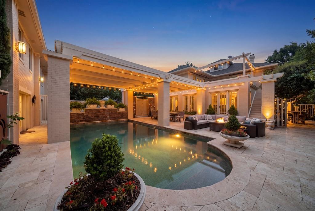Elegant 4 BR, 2.5 bath estate on Dallas' coveted Swiss Ave awaits its new family for the 1st time in over 30 years. This home is nestled on .37 acres among a lusciously landscaped yard, resort style back yard with pool and hot tub plus the ever so rare 920 sq.ft., remodeled guest quarters providing 1 extra bedroom and 1 bathroom NOT included in the square footage and room count of the main house for a property total of 5 bedrooms and 3.5 baths. The guest quarters is currently rented month-to-month at $2550 which has brought in significant income year after year. The 1st floor of the main house offers a formal living area in front, and an add'l, open-concept living room in the back of the house that was added in 2009 replete with tons of natural light beaming through the floor-to-ceiling windows. Connecting the 2 living areas lies a large dining room with plenty of space for family meals and gatherings. One of the prime areas of this home is the true chef’s kitchen which was completely remodeled with custom cabinetry and a super efficient layout. Upon ascending the grand staircase, you will find 4 graciously sized bedrooms connected by a central landing. The primary suite boasts a gorgeous custom ensuite bathroom with dual vanities, separate tub-shower and marble counters, flooring and shower tile. In addition, there is a sunroom off of the primary suite which works great as a reading room or TV lounge. Need a home office or workshop? You will find that too located under the guest house just off the pool area. The backyard is an entertainer’s paradise with a large pool, state of the art jetted hot tub (which conveys with acceptable offer), outdoor seating area and grilling area offering an outdoor sink and extended table seating. As if the backyard resort was not enough, the new owners will also enjoy the large rooftop entertainment area accessible via the primary suite and one of the secondary bedrooms overlooking the pool. Don't miss the basement for added storage.